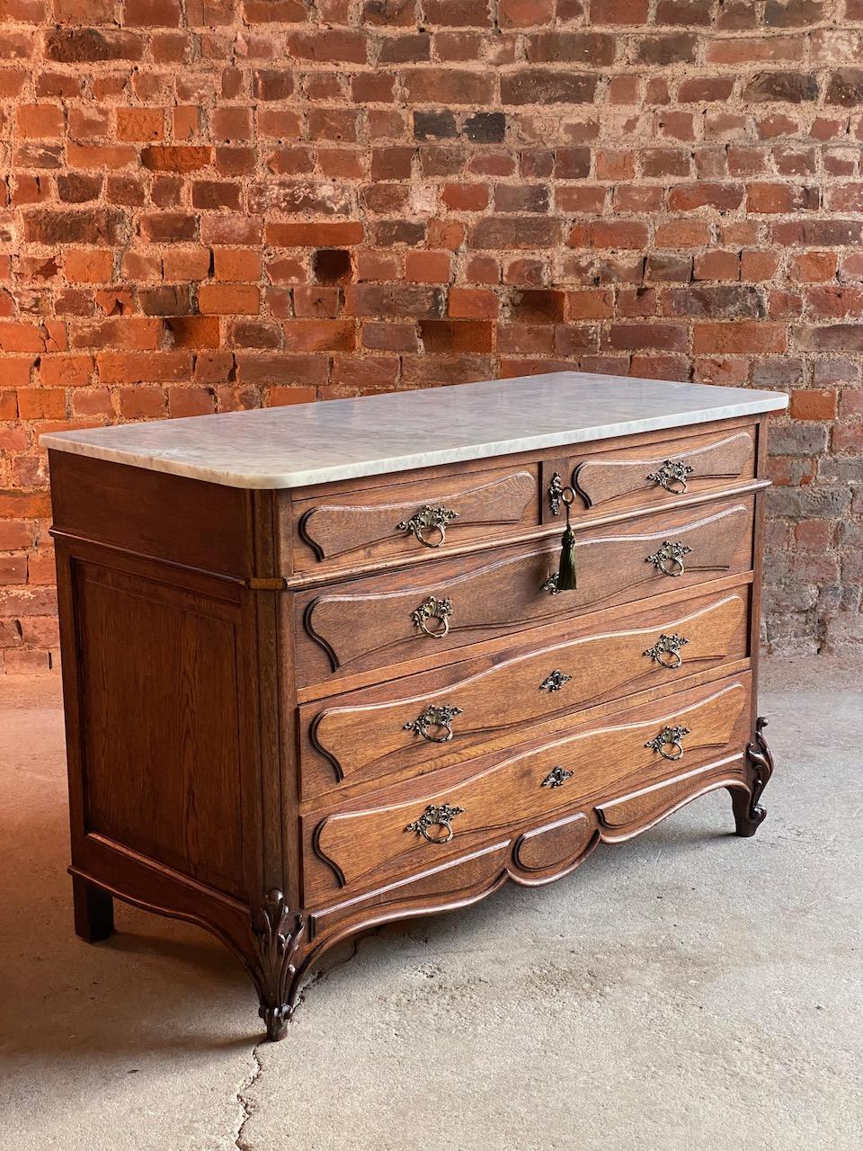 Antique French marble chest of drawers commode France circa 1890 number 12

Beautiful French antique marble topped oak commode chest of drawers, circa 1890, this chest dates to the late 19th century, the elegant white with grey veins marble top