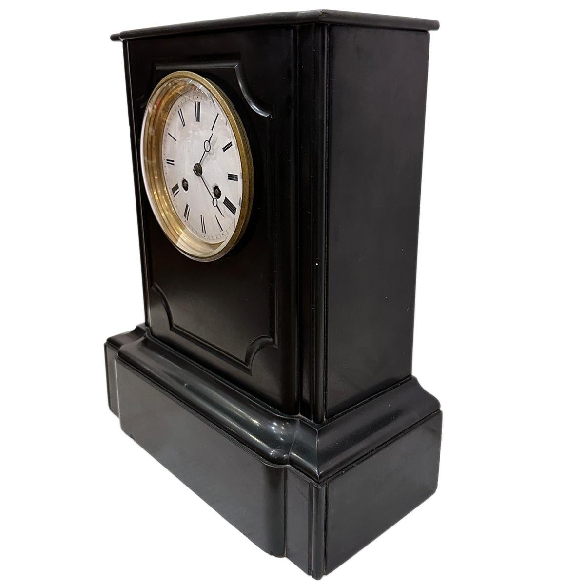 A circa 1920's French black marble mantel clock.

Measurements:
Height: 15