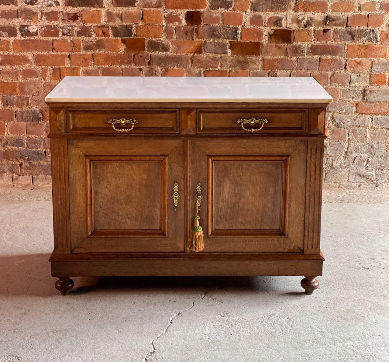 Antique French marble cupboard France, circa 1870 number 3

A stunning antique Napoleon III marble topped golden oak free standing cupboard dating to France circa 1870, the rectangular white marble top with a light pink vein over two short drawers