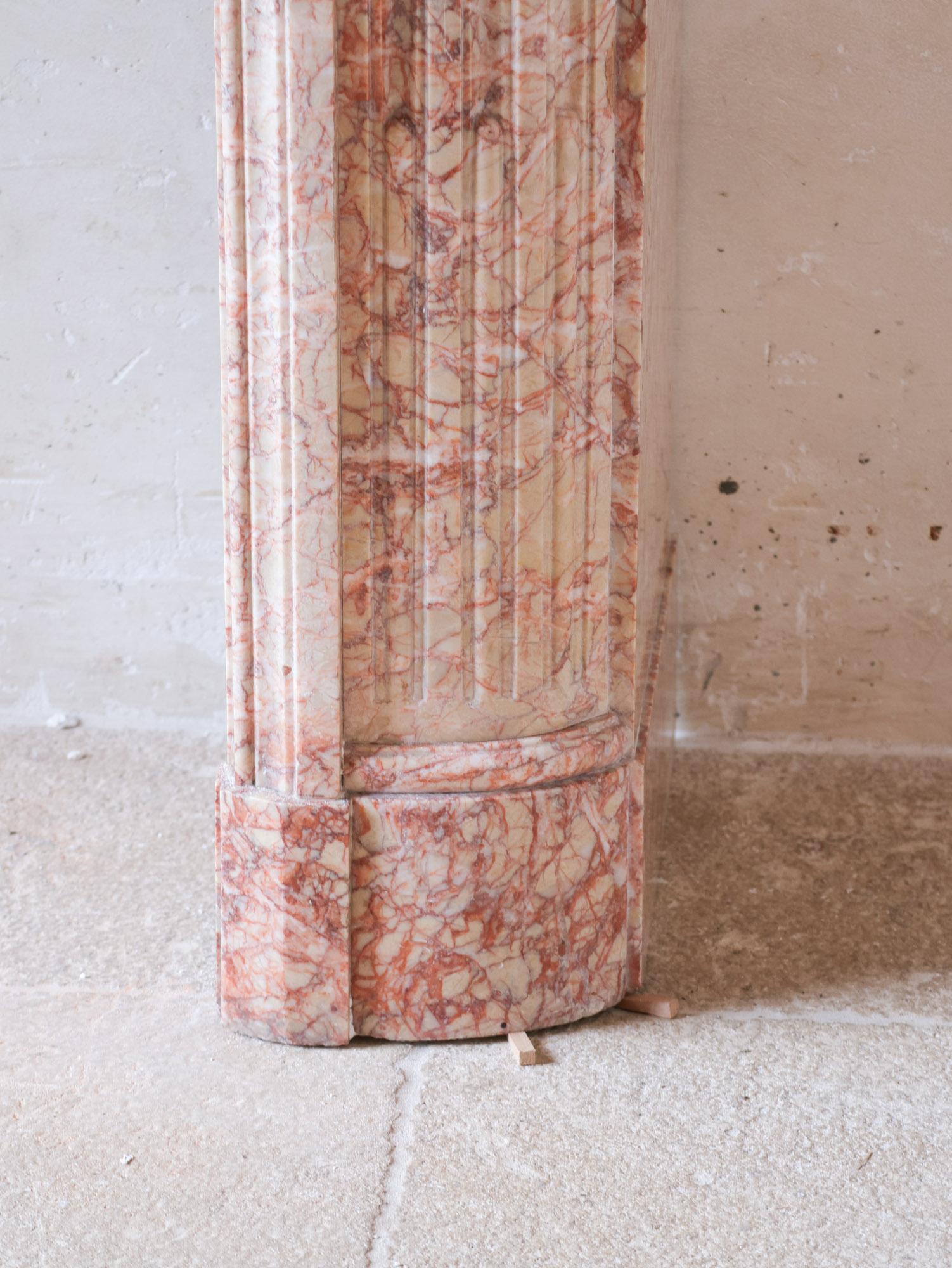 Marble Antique French marble fireplace in pink tones For Sale