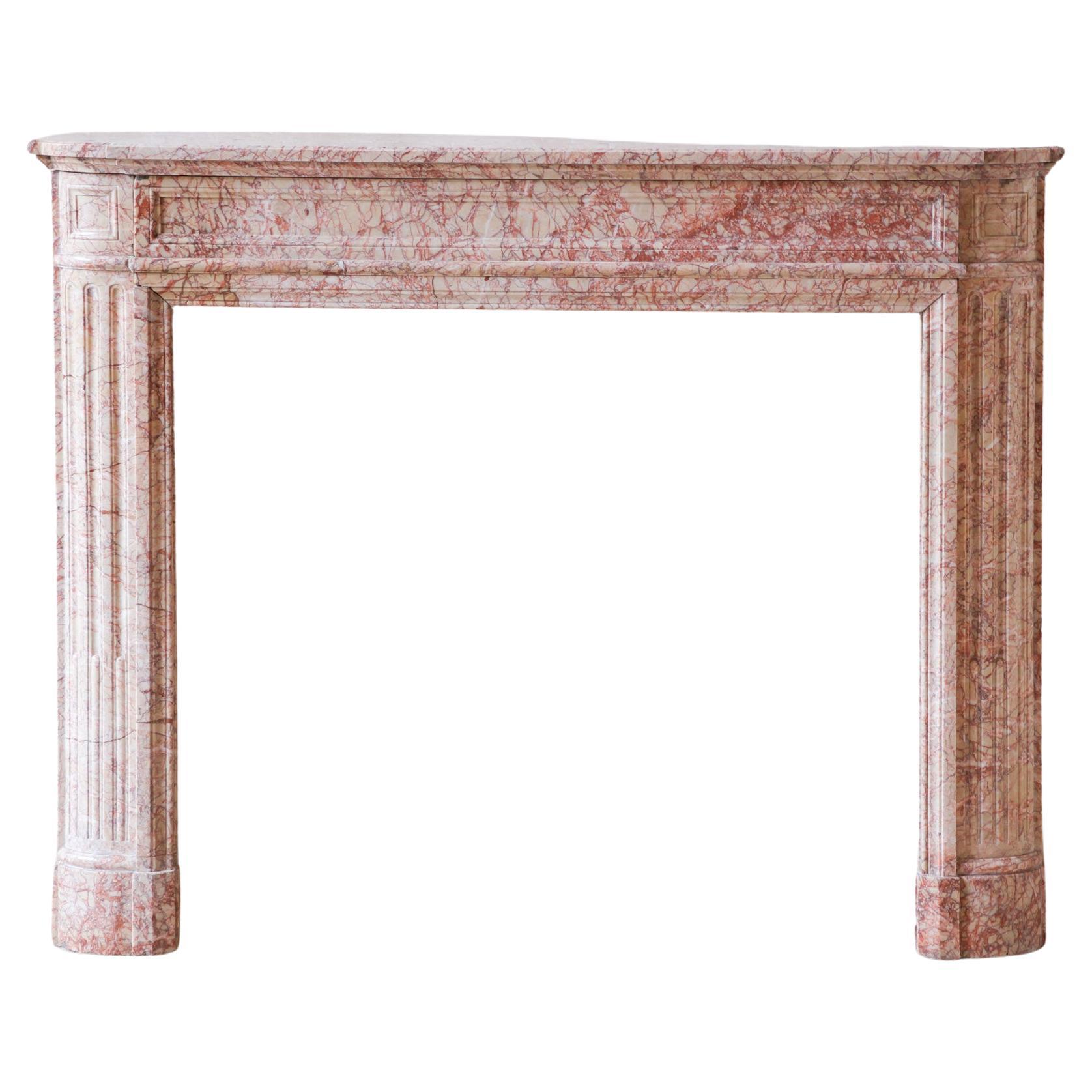 Antique French marble fireplace in pink tones For Sale