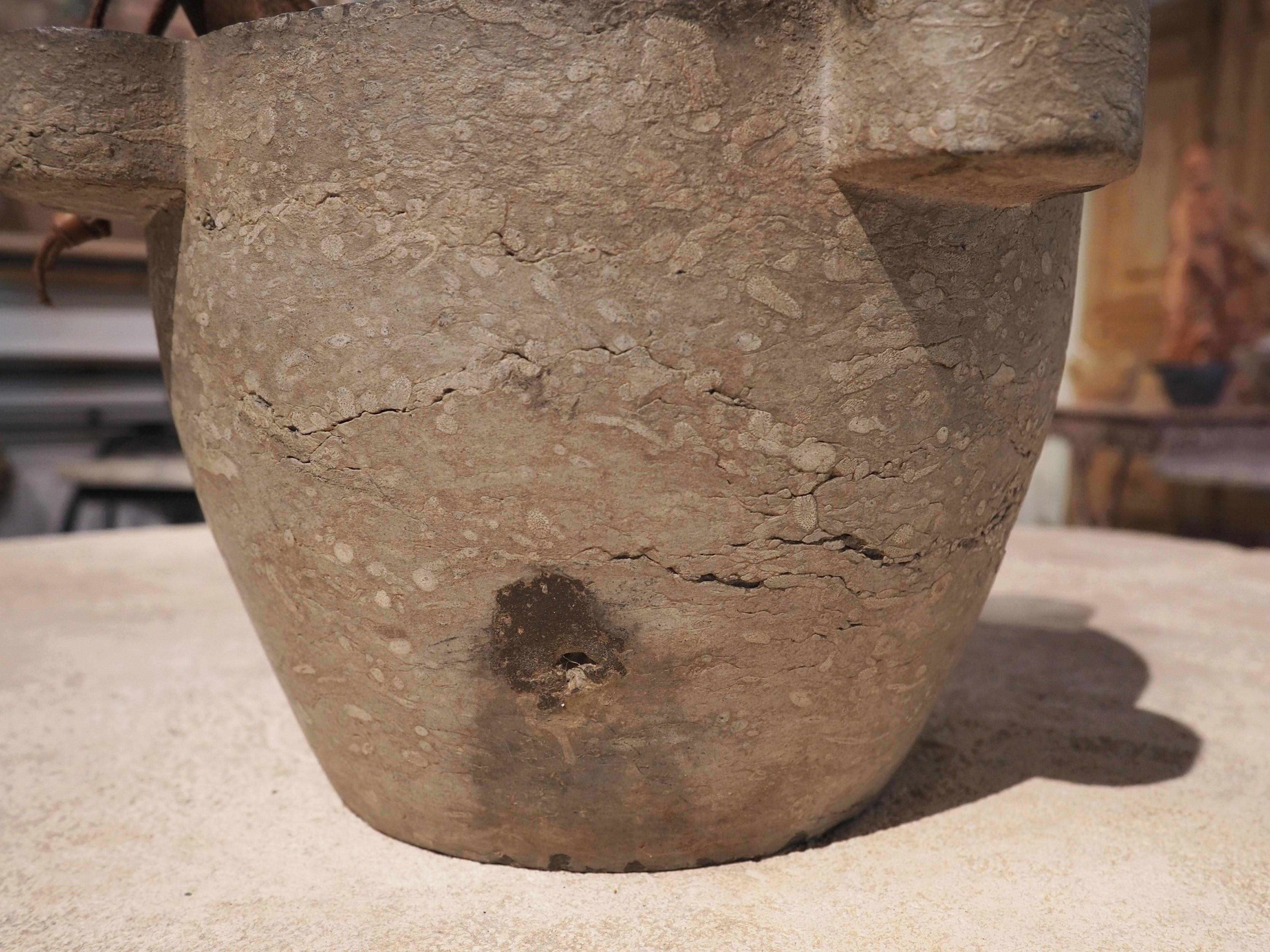During antiquity, mortars and pestles were used to grind up herbs for cooking or by pharmacists to make medicinal powders. They are typically constructed from a hardened substance, such as this 19th century French marble mortar. The light gray stone