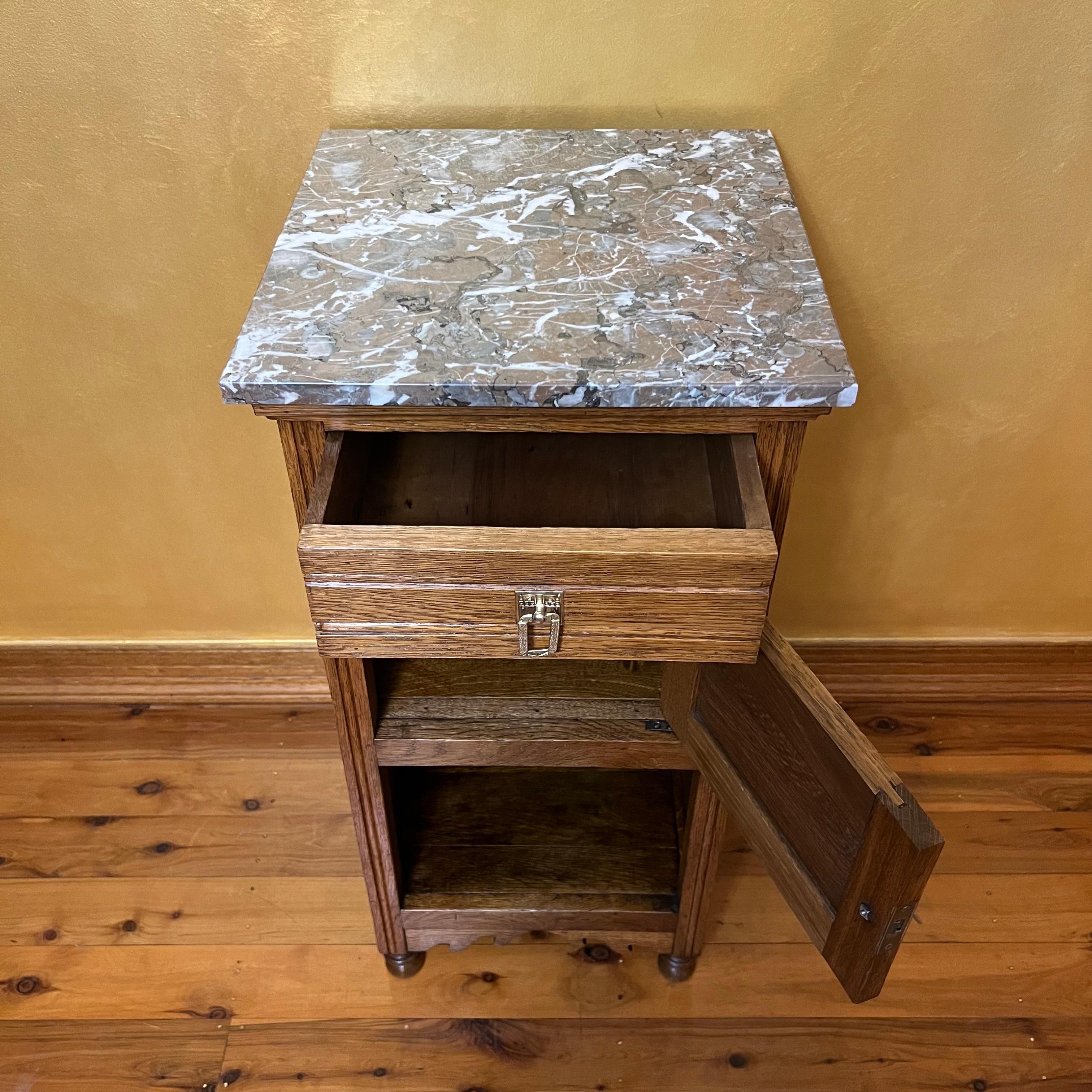 Marle marble top with oat base, has top draw, cupboard and open shelve on bottom, curved bottom detail, brass has been polished, timber has been French Polished. 

Circa: 19th Century 

Material: Oak 

Country Of Origin:  France 

Measurements: 83cm
