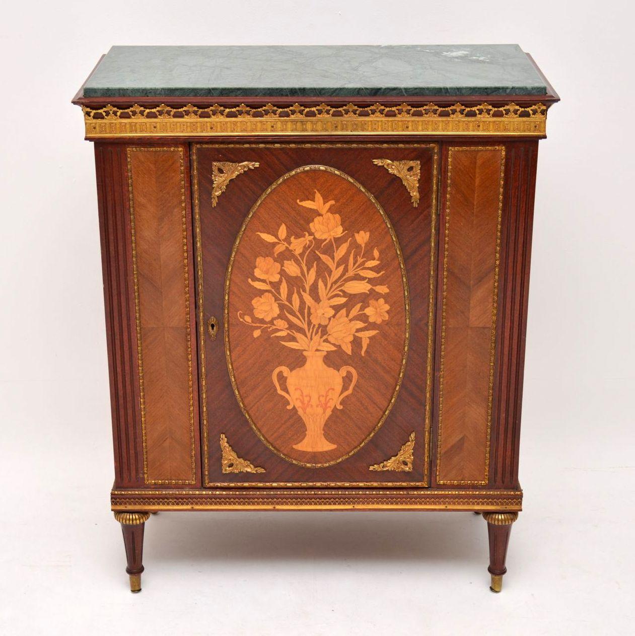 Antique French style marble top cabinet dating from circa 1930s period & with some lovely decorative features. It’s in good condition throughout including the lift off original marble top. There are gilt metal galleries top & bottom, plus lots of