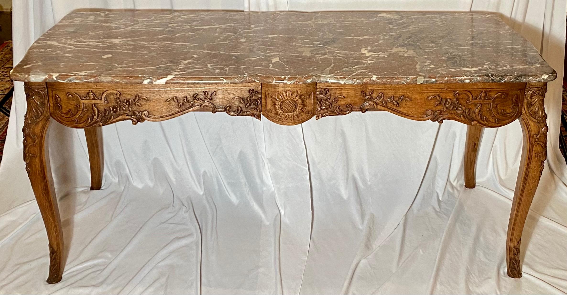 Antique French marble-top carved Regency center table, circa 1890. Wonderful carving and a fine example of craftsmanship.

 