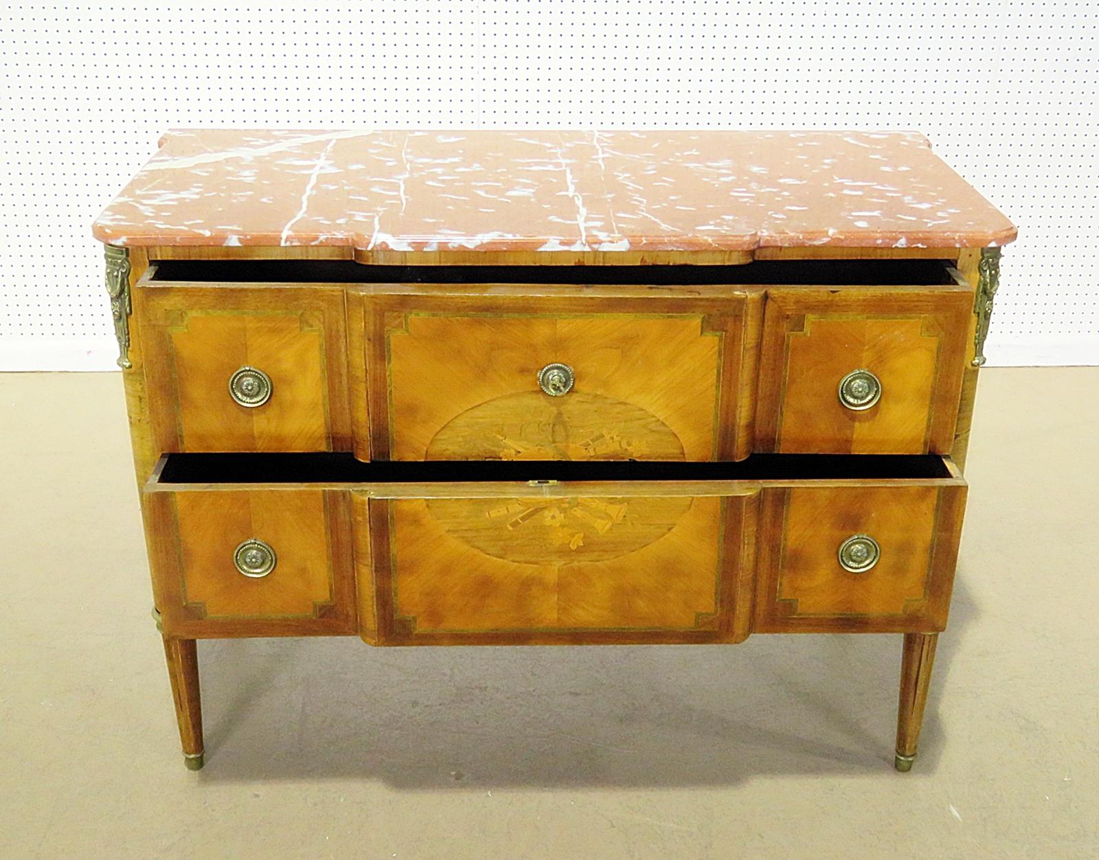 Antique French inlaid 2-drawer commode with bronze accents. This piece is shown with some defects which we will repair seamlessly for the buyer. This a beautiful piece that will be even better when we have professionally detailed it and removed the