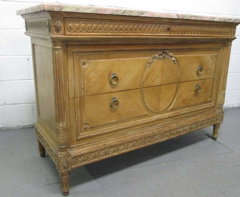 Antique French marble-top dresser. Has original handles, hand-cut dove tails. Lovely carvings and columns to the front sides. Marble is one inch thick and very colorful. Total of three pull-out drawers.