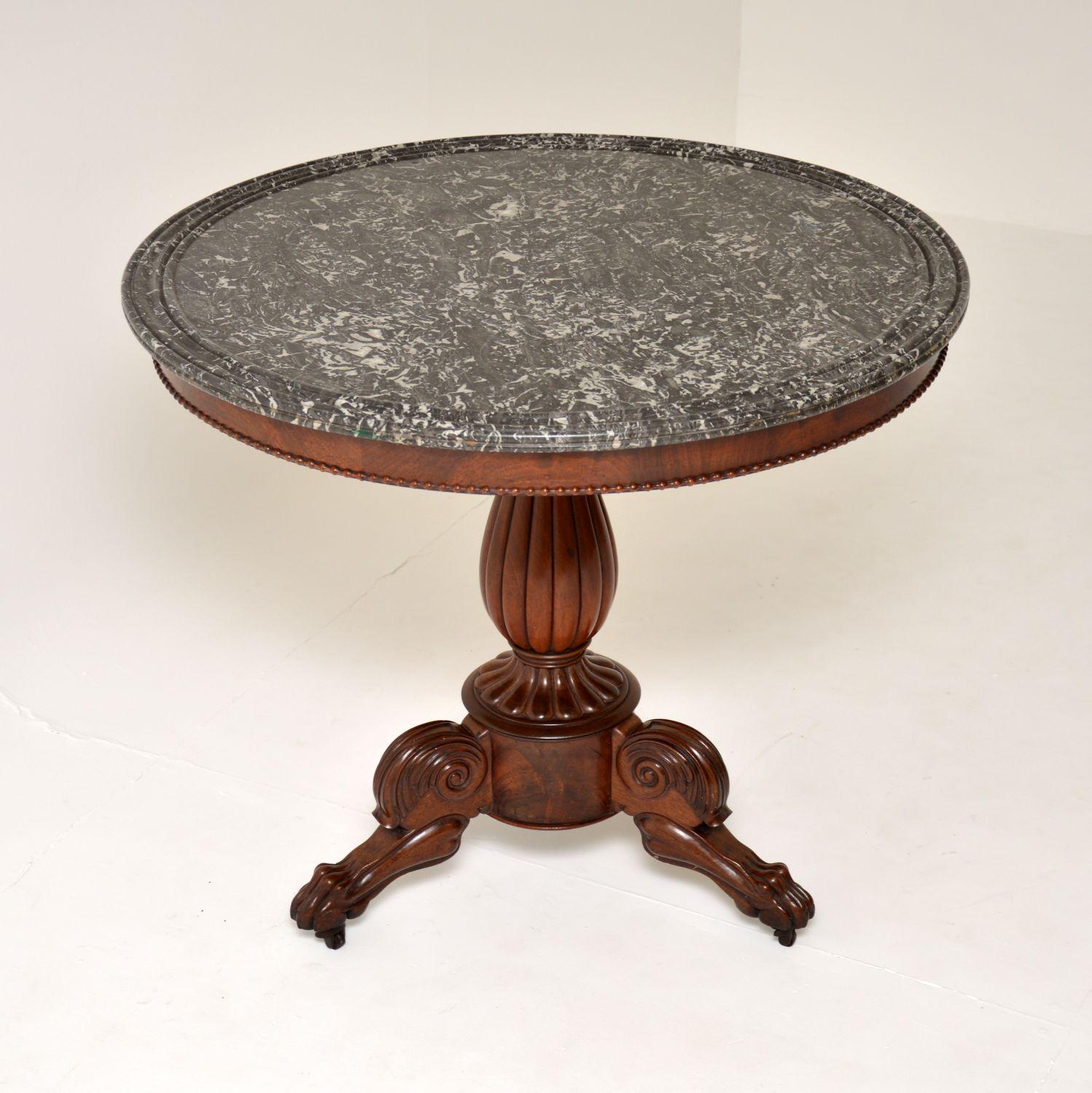 A beautiful original antique French Gueridon table, dating from around the 1830’s period.

It is of superb quality, with a stunning original grey marble top and wood base.

The marble top has a moulded edge, it is very thick and well made. The