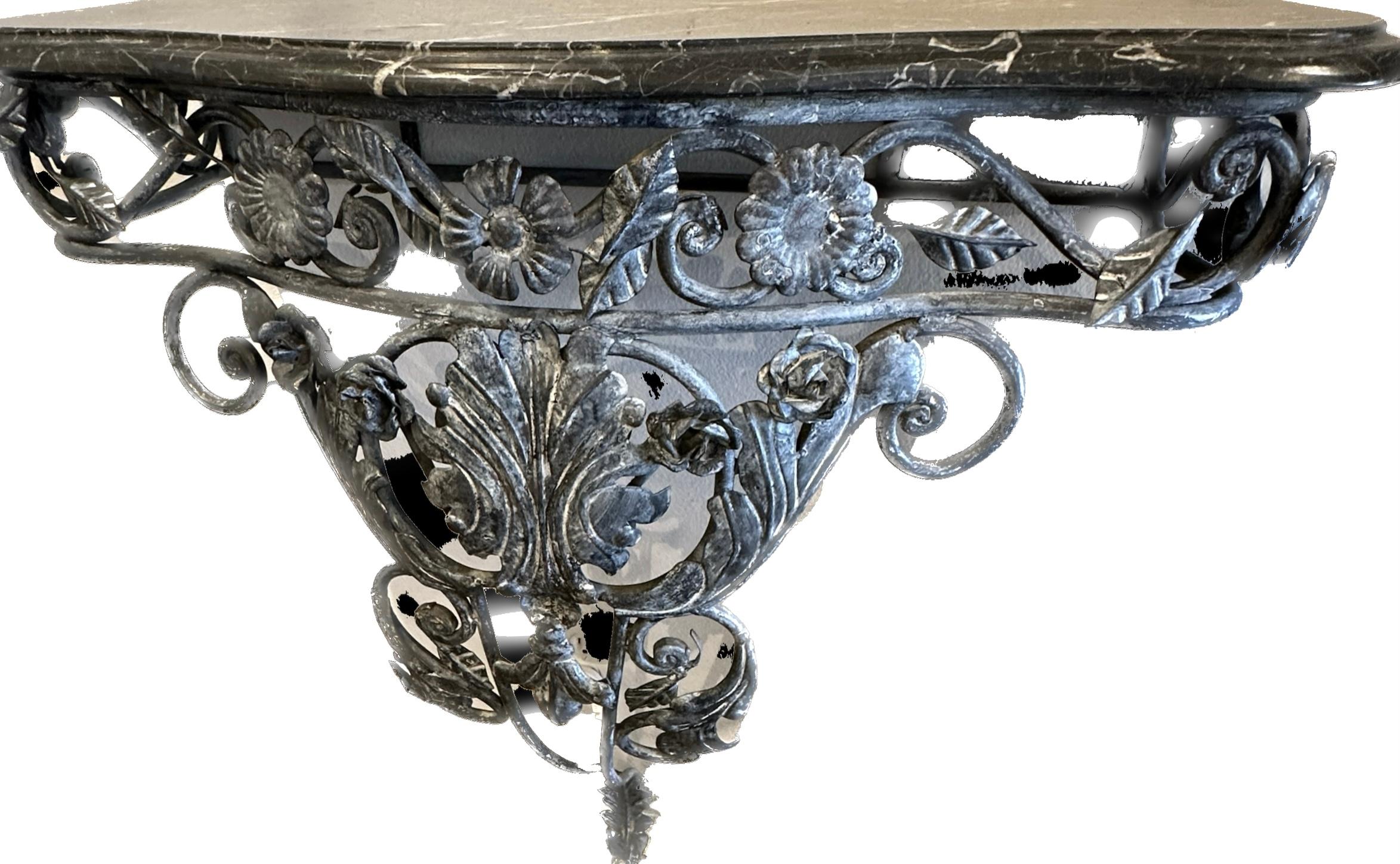 Bow front, Wall console table in floral wrought iron base.  Top is black and white Italian marble with bevel edge.  