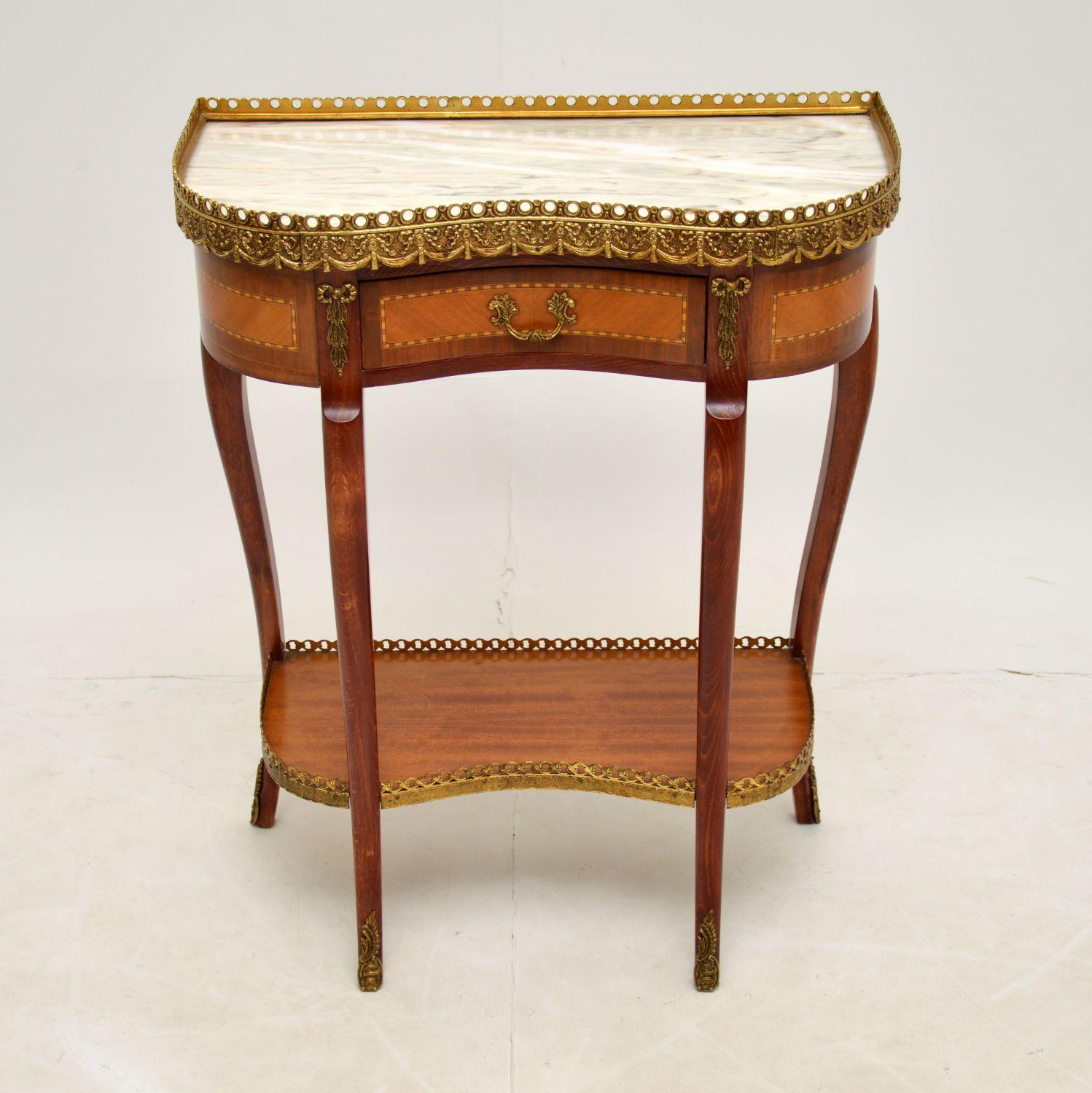 An excellent marble top kidney shaped side table, in the antique French style & dating from around the 1930’s period.

The quality is amazing, with fabulous gilt bronze mounts, and a beautifully shaped solid wood frame with lovely inlaid drawers