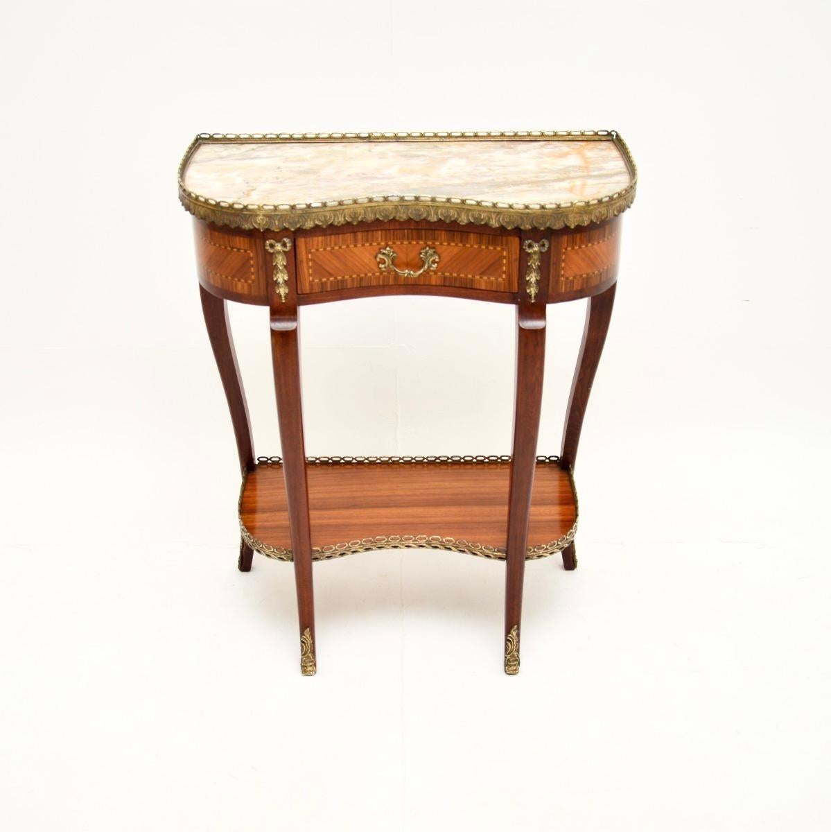 A beautiful antique French marble top kidney side table, dating from around the 1930’s period.

The quality is amazing, with fabulous gilt bronze mounts, and a beautifully shaped solid wood frame with lovely inlaid borders on the drawer and sides.
