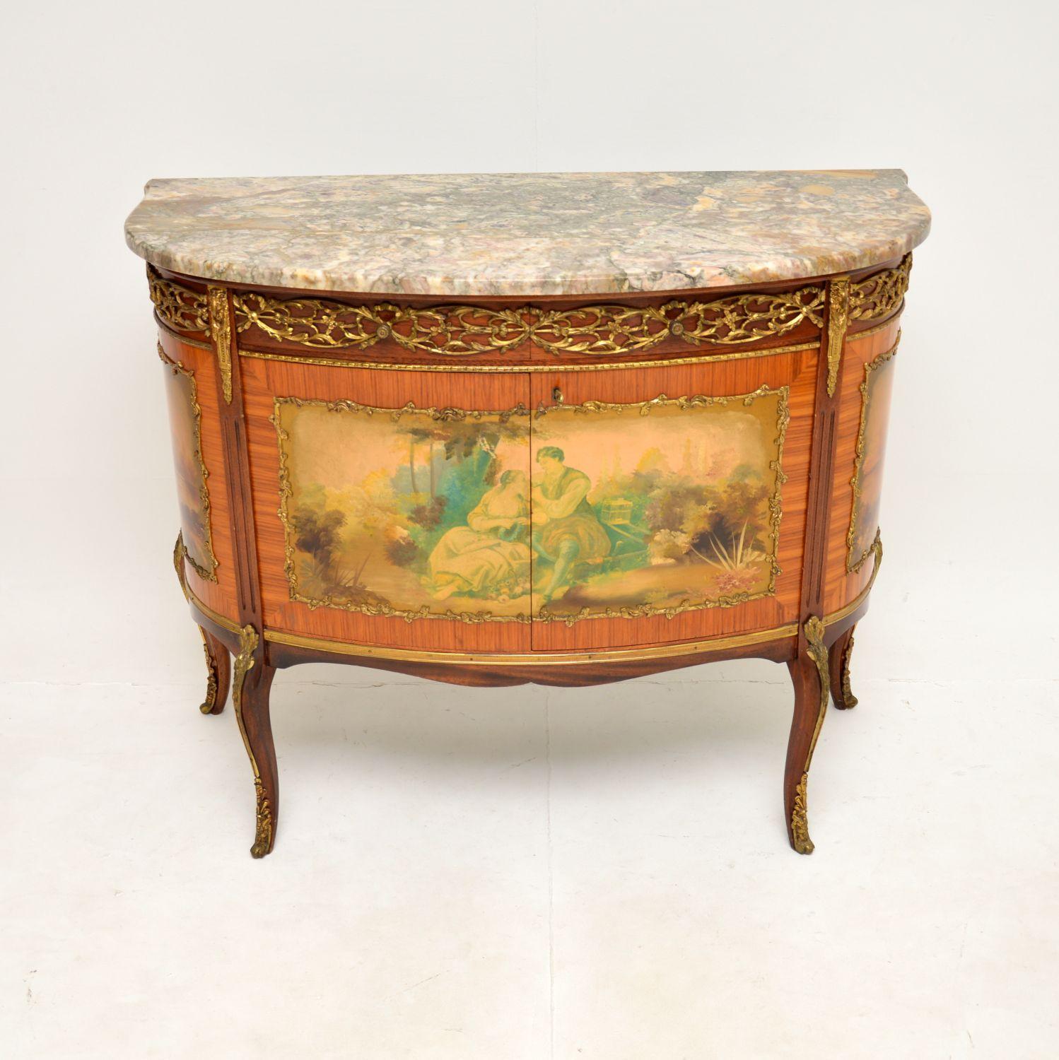 A stunning antique French marble top painted cabinet. This was made in France, it dates from around the 1920-30’s.

It is of superb quality, this is a useful size and has a gorgeous marble top with a bow fronted edge. The cabinet has absolutely