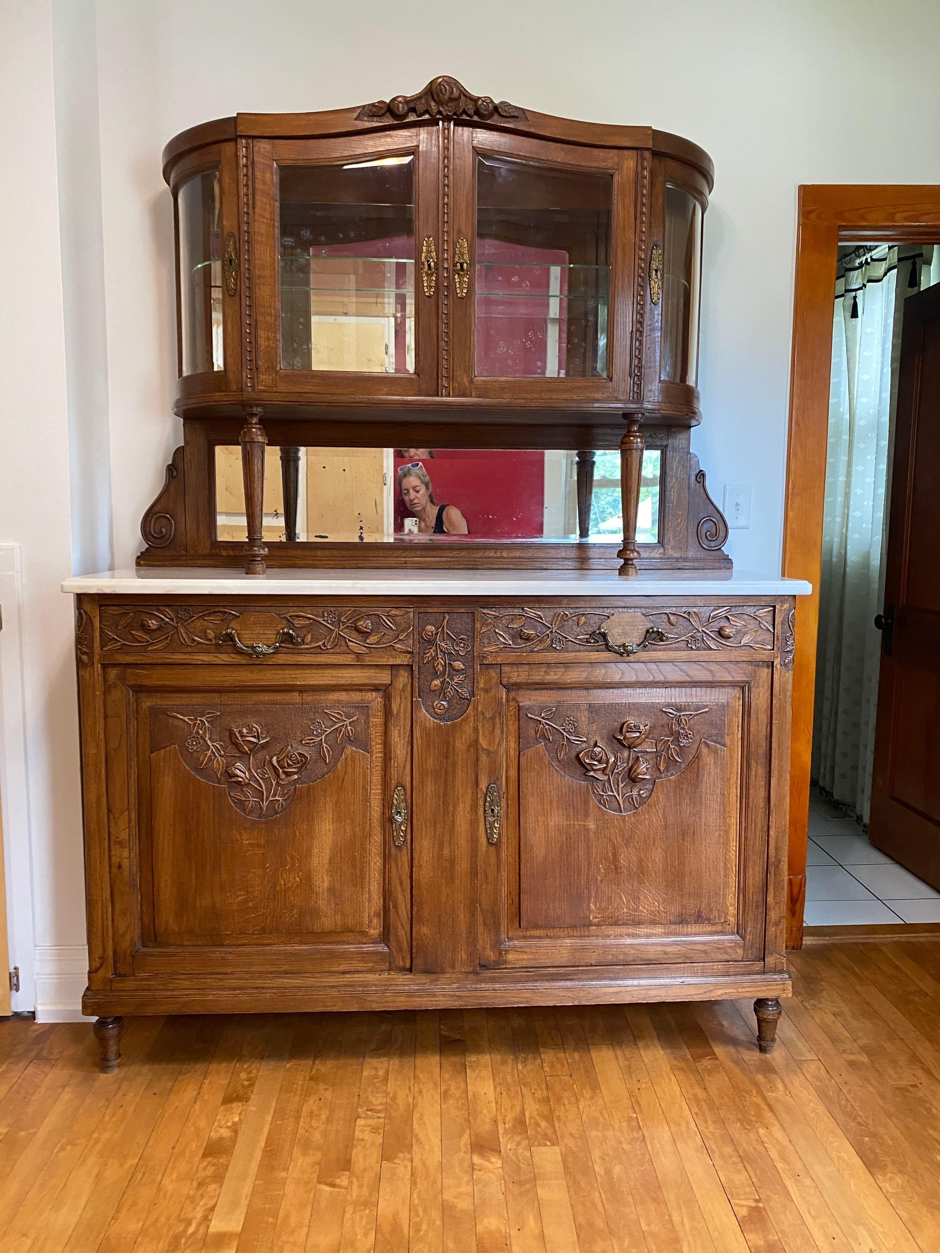Antique French Marble Top Server Buffet With Mirror Back Display Cabinet. Cabinet, made of oak. features a rectangular bottom portion, richly carved, with 2 locking doors and 1 shelf, with 2 drawers above. The marble was replaced in France over 20