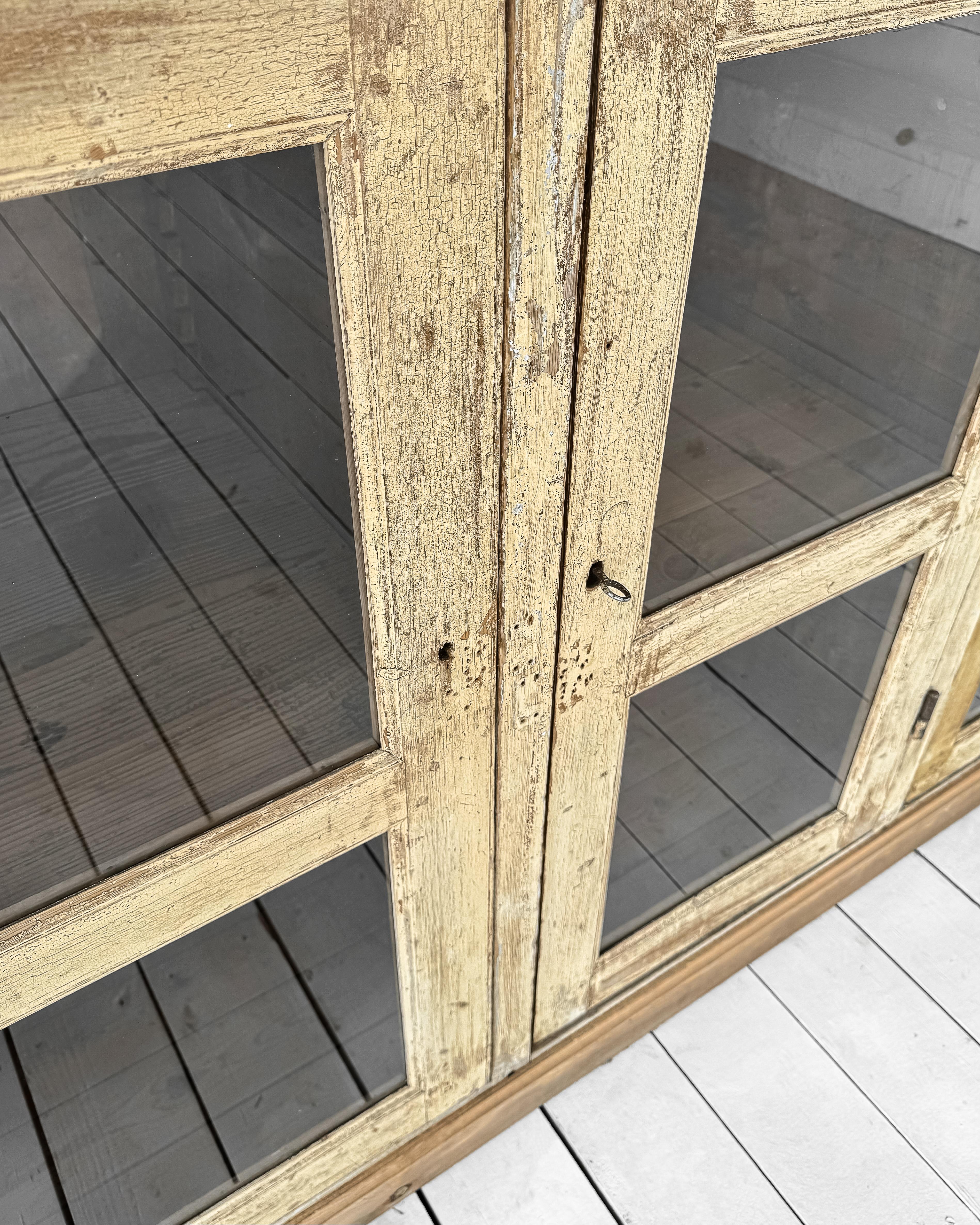 Antique French Mercantile Showcase with 4 Doors 11