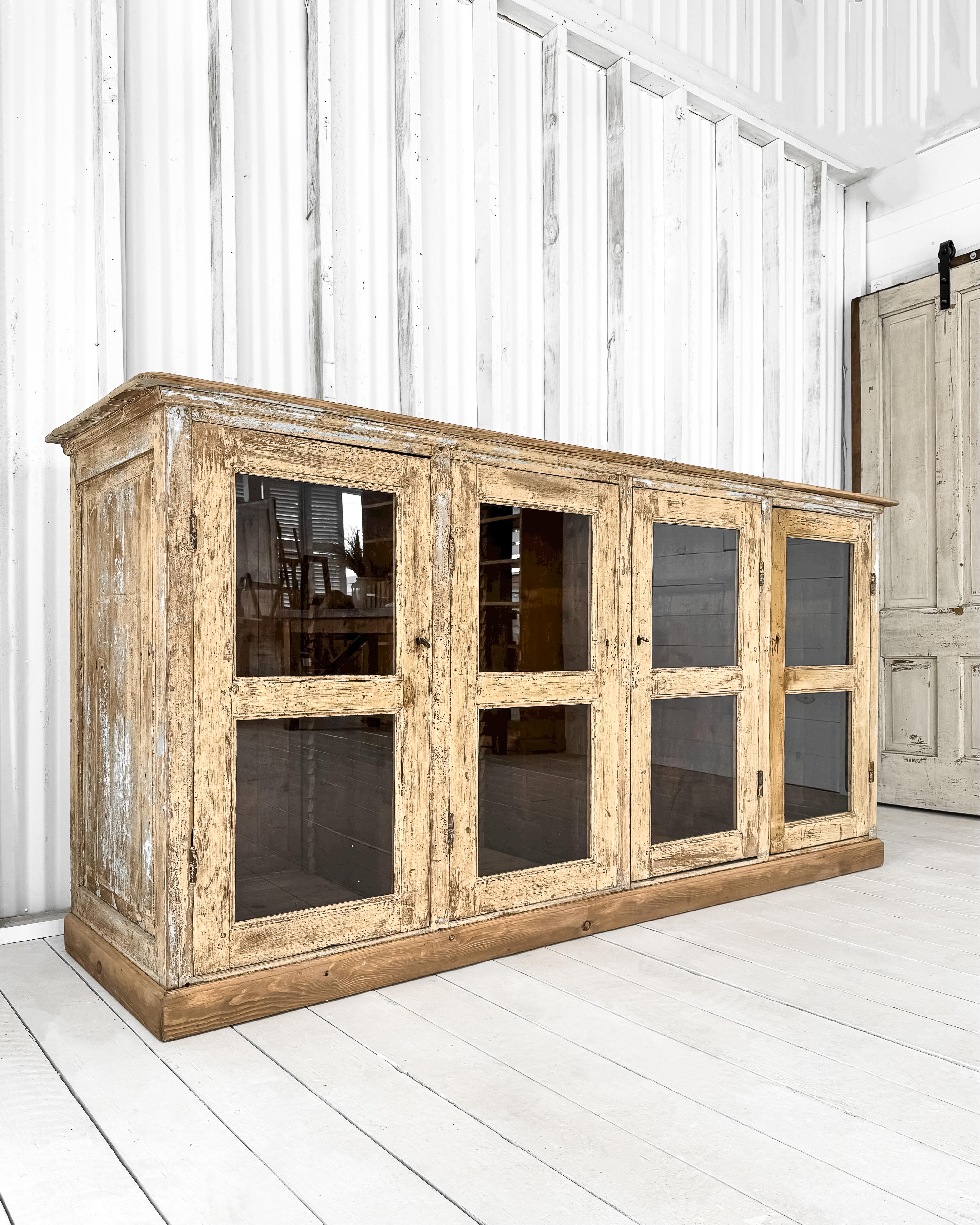 20th Century Antique French Mercantile Showcase with 4 Doors For Sale