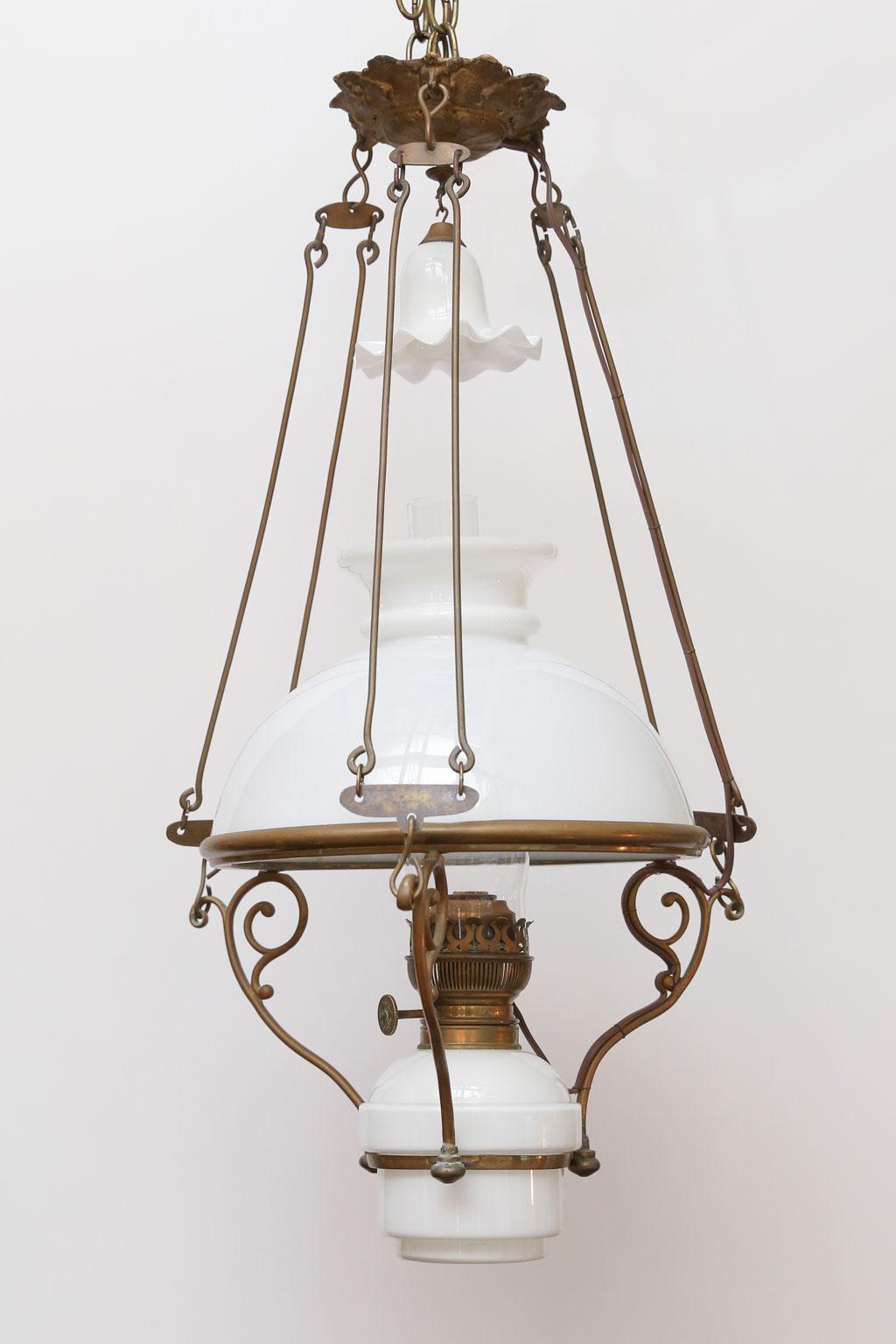 Antique French milk glass hall lantern, originally operated by oil and now newly wired for use within the USA (using all UL approved parts) as a hanging pendant or lantern fixture. Wonderful and unique this circa 1900 hall lantern consists of a milk