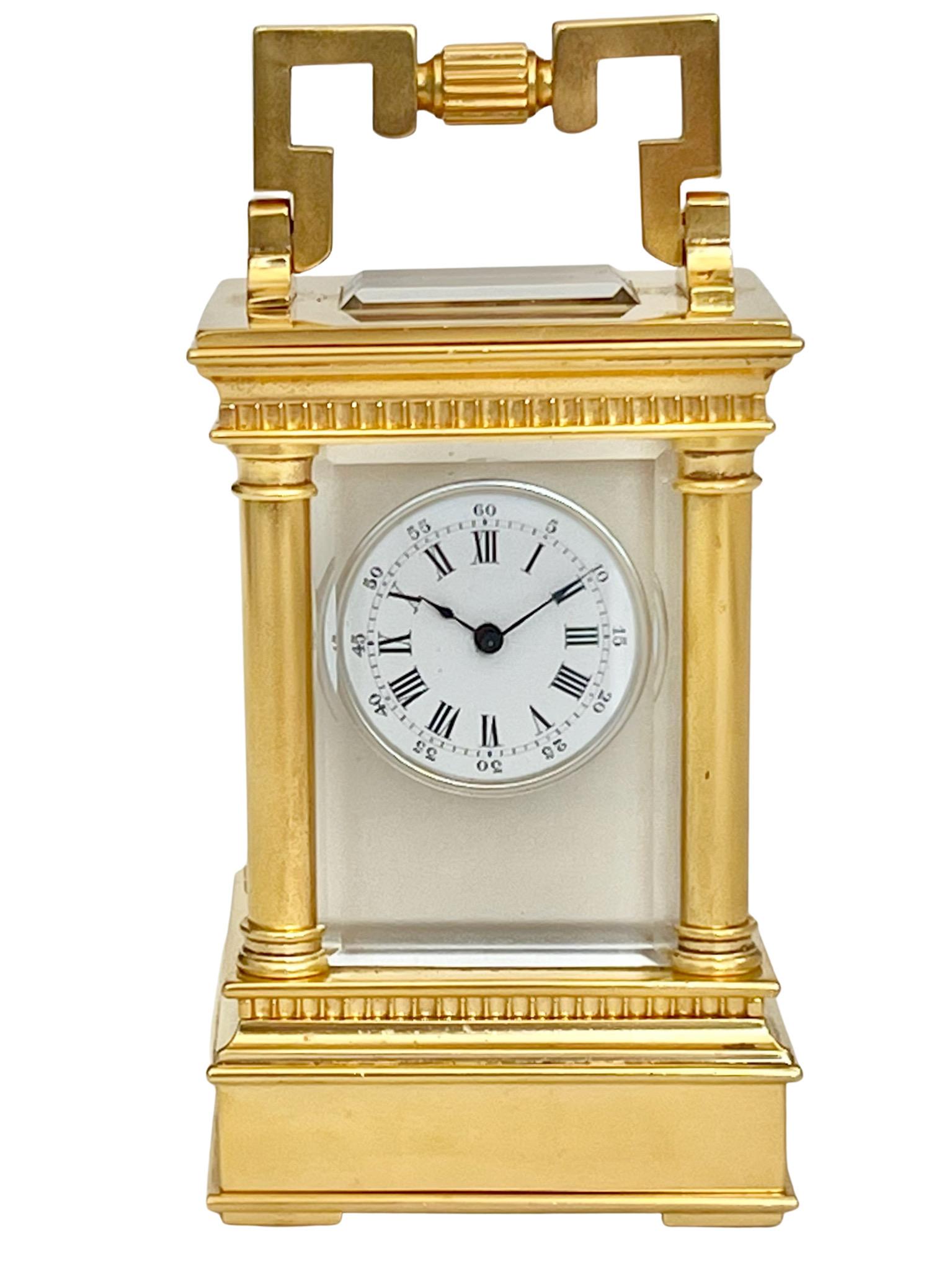 French Miniature timepiece carriage clock with original travel case. This is a very attractive miniature carriage clock in a beautifully executed Anglais Riche case with rounded columns, ripple mouldings, square glazed viewing aperture and hinged