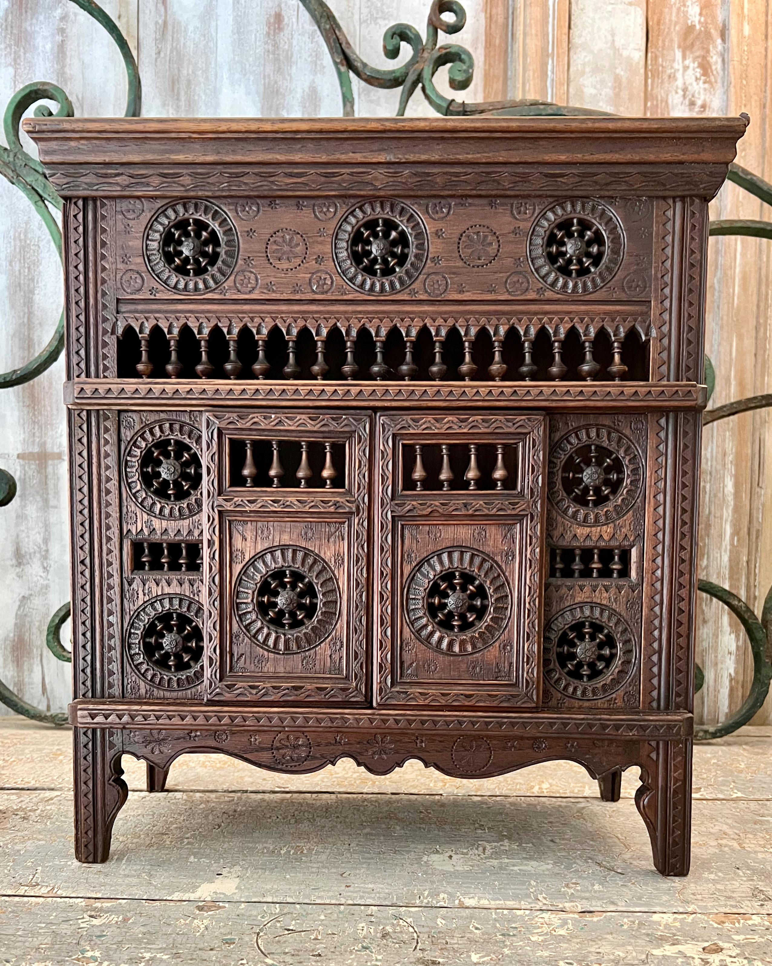 Charming antique French miniature oak Brittany cabinet with richly hand-carved details.
Brittany, France