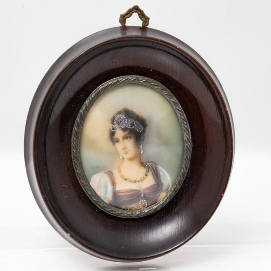 This exquisite antique French miniature painting captures the allure and elegance of a beautiful woman adorned with exquisite jewelry. Signed by the artist, this delicate artwork is a testament to the skill and artistry of the French miniature
