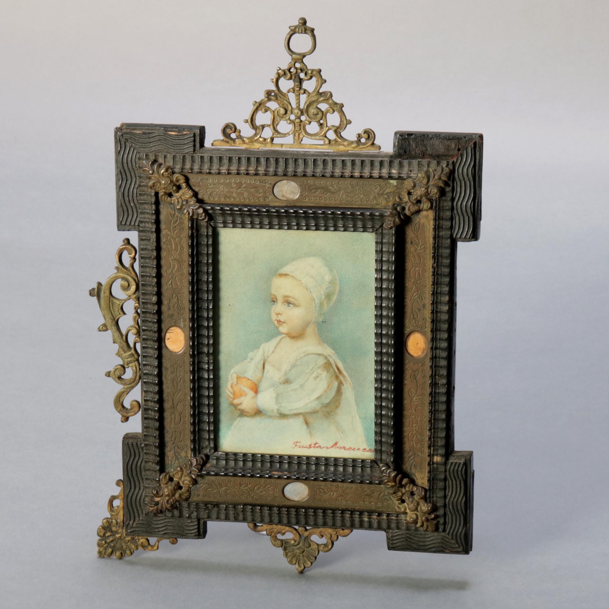 An antique French miniature watercolor painting depicts portrait of a baby and is signed illegible lower right, seated in Folk Art carved wood frame with floral incised inset and having foliate and scroll cast bronze accoutrements, 19th