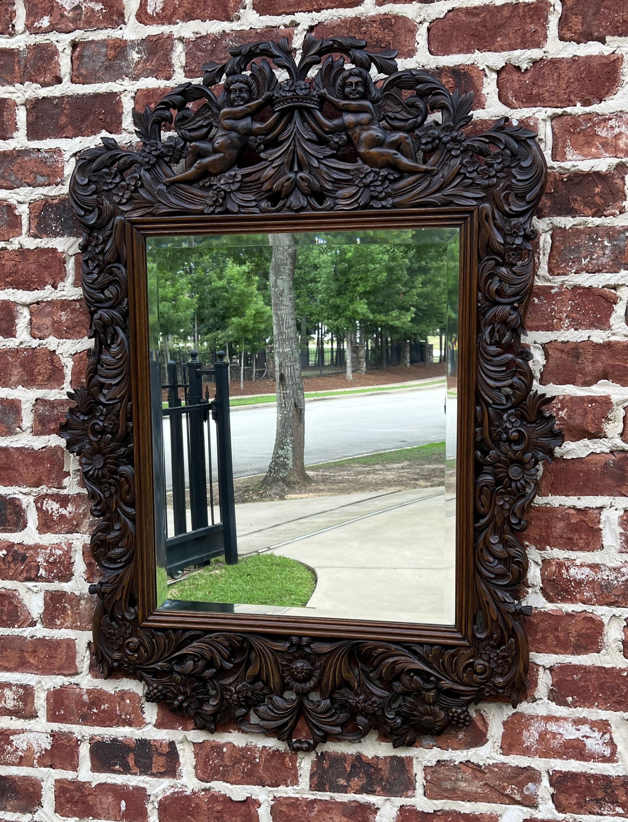 GORGEOUS Antique French Rectangular Framed HIGHLY CARVED Oak Wall Mirror~~ Carved Cherubs and Beveled Mirror ~~circa 1900s
 
Popular classic French hanging wall mirror~~beautifully carved cherubs with wood back~~perfect for an entry hall, living
