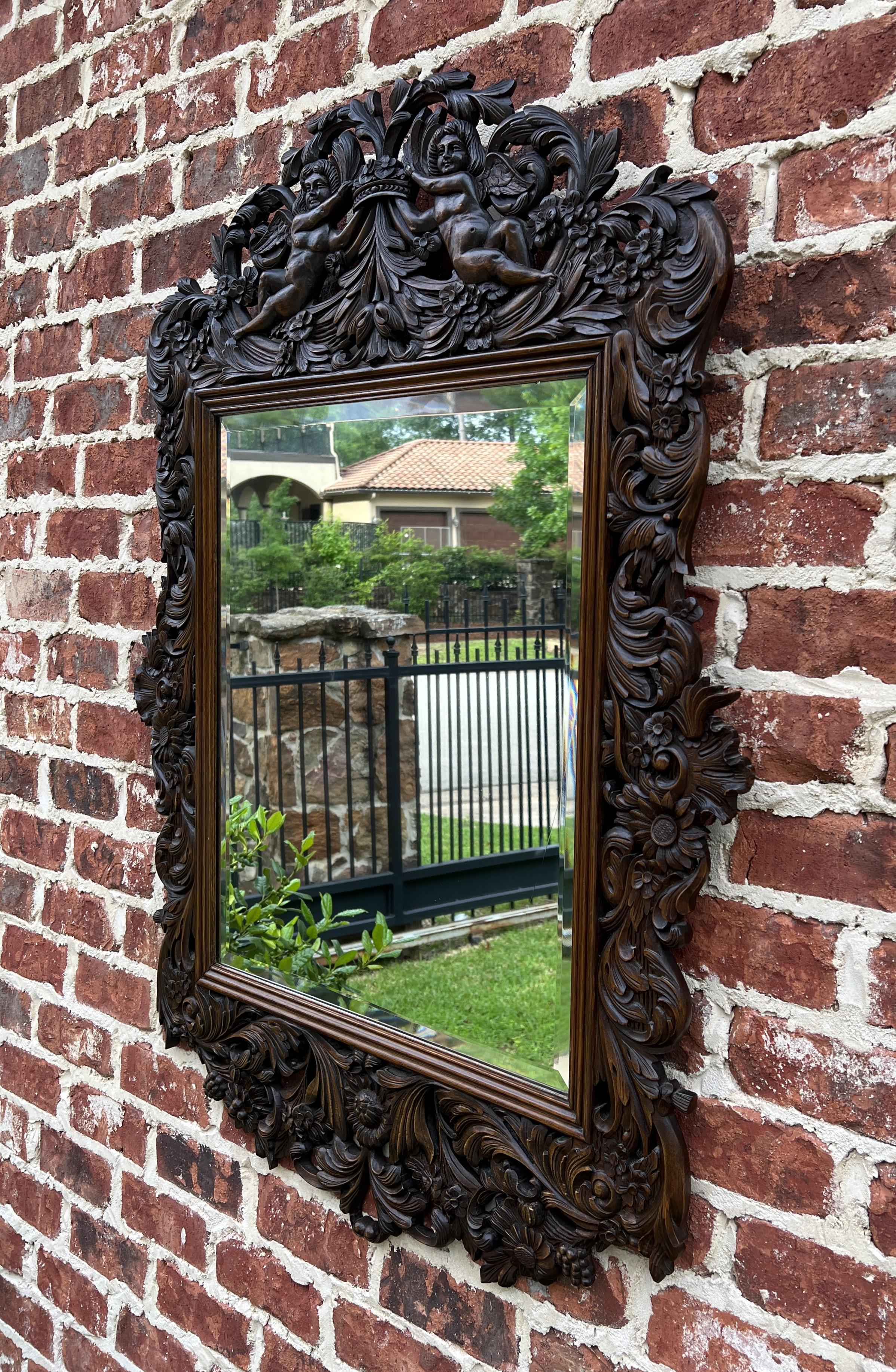 Renaissance Revival Antique French Mirror Framed Hanging Wall Mirror Cherubs Beveled Rectangular Oak For Sale