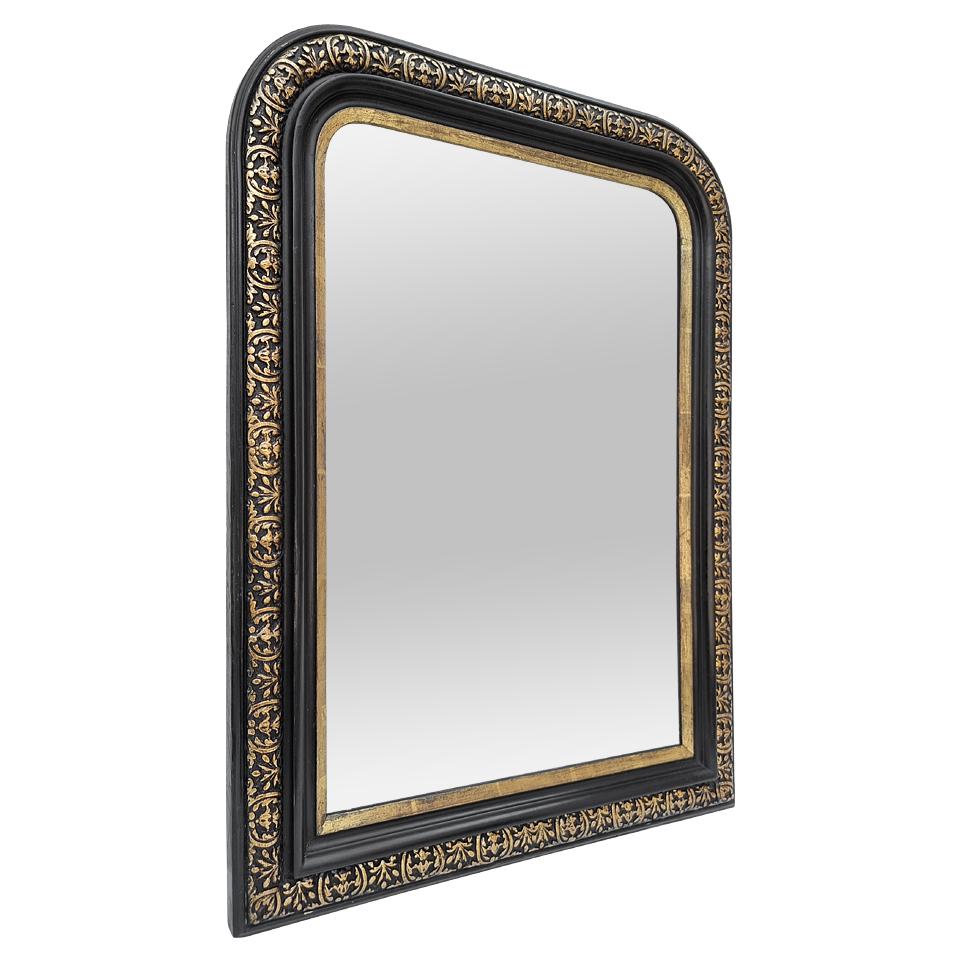 Antique French mirror Louis-Philippe style (for the shape), Napoleon III period , circa 1870. Antique giltwood and black colors frame, gilding to the leaf patinated, adorned with stylised foliages and golden fillet near the glass mirror. (Antique