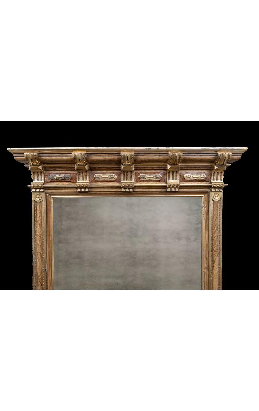 A tall antique French mirror in the Napoleon III style.

With original wood-grain effect and burnished gold-gilt frame. 

Original plate glass mirror in good condition.

Circa 1860

Additional information:
Measurements:
Width: 52