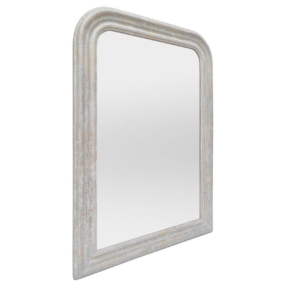 Antique French mirror of Louis-Philippe style, circa 1930. Antique frame of light gray color patinated with a few touches gilding to the leaf. (Antique frame width measures: 6.5 cm / 2.36 in.). Modern glass mirror. Wood back.