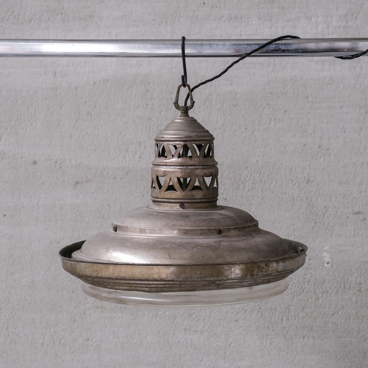 A large pendant light, metal framed, with a glass shade, internally there is original glass reflectors.

France, c1920s.

In addition there is an original four way bulb extender to allow for four bulbs.

A highly original and unique piece.

Good