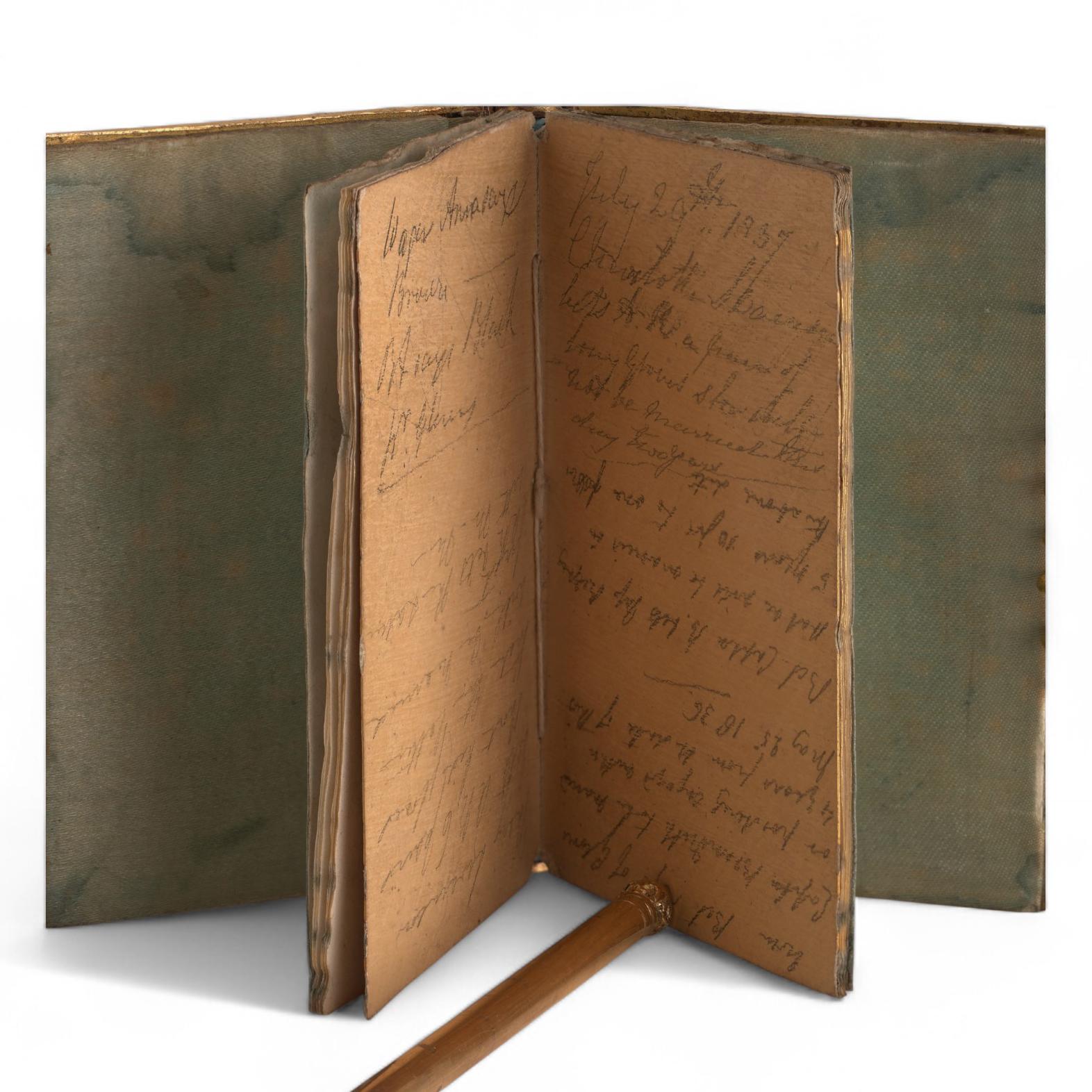 This early Victorian French notebook was made as a luxury souvenir piece rather than a standard writing pad. The covers are veneered in mother-of-pearl, engraved with decorative motifs and centred with the inscription “Souvenir.” The panels are