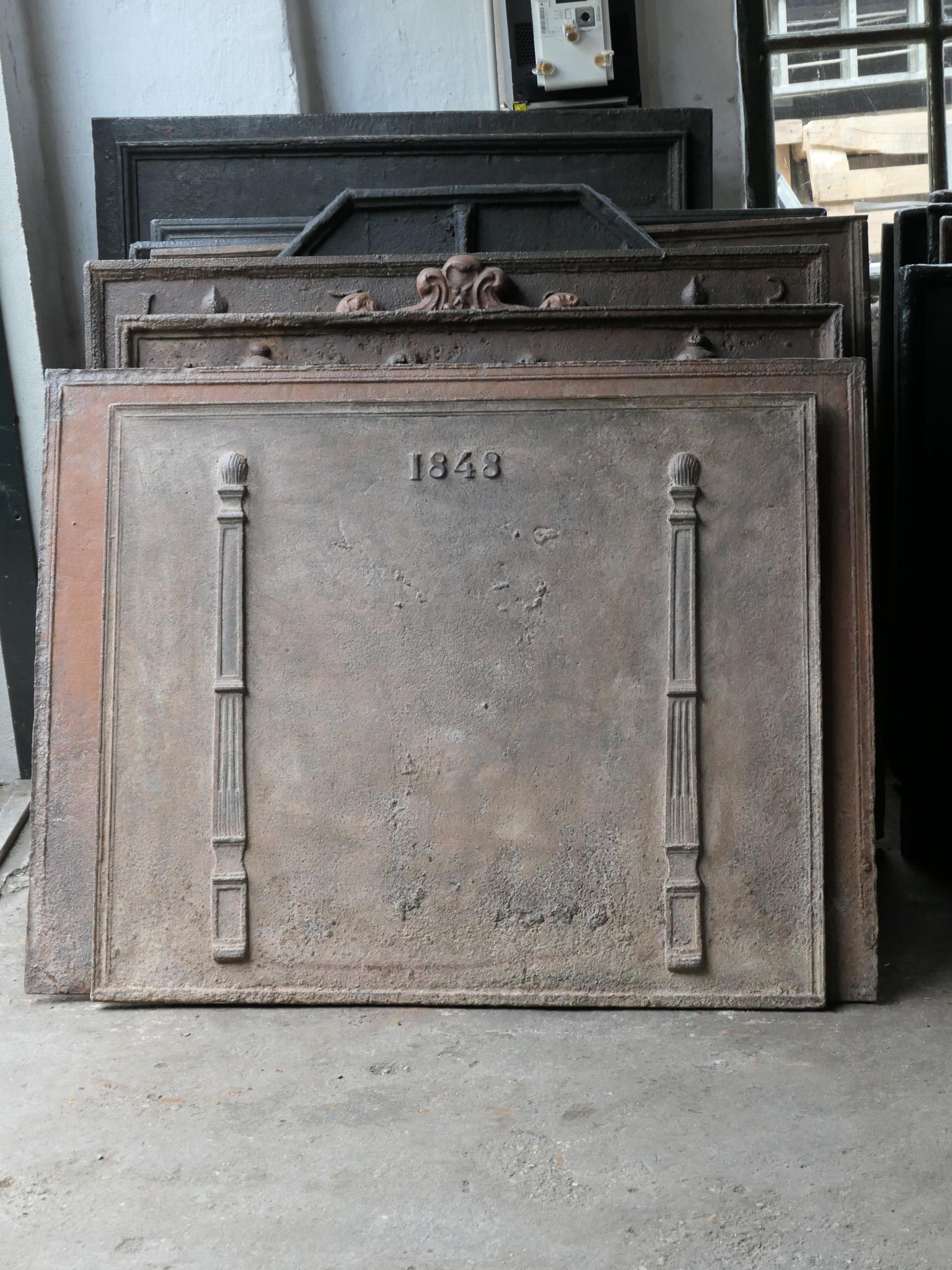 18th century French Louis Napoleon III fireback. The date of production, 1848, is cast in the fireback. The pillars refer to the club of Hercules and symbolize strength and the unknown.

The fireback is made of cast iron and has a natural brown