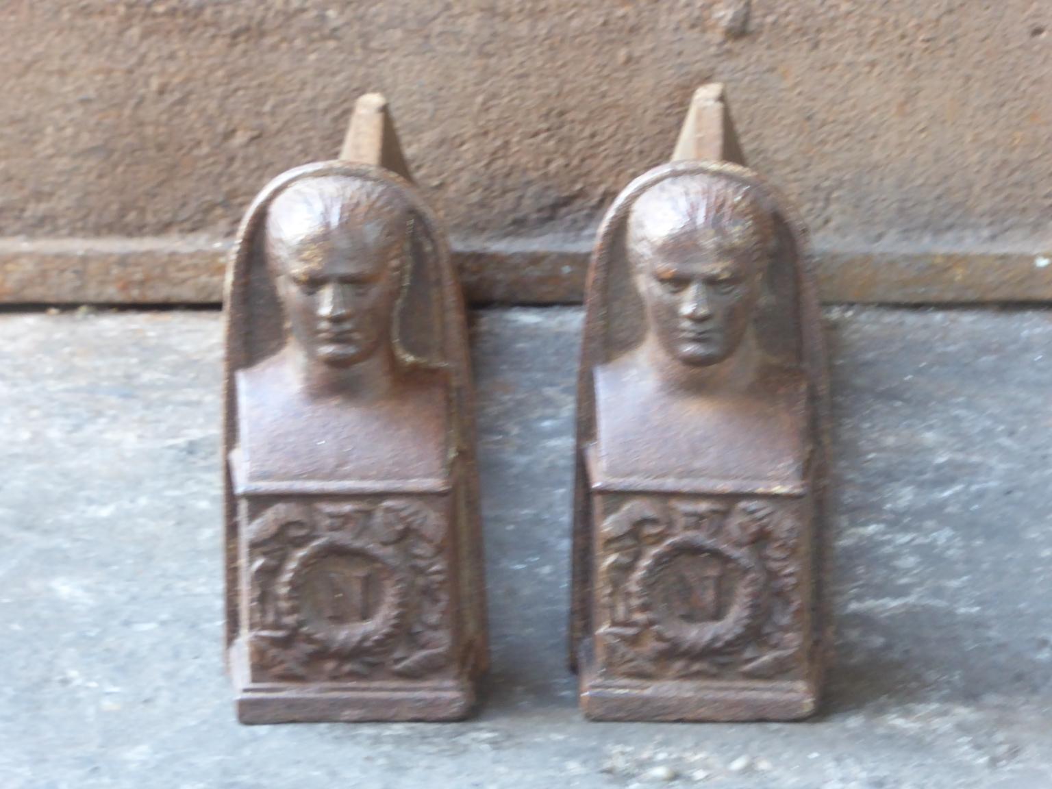 19th century French Napoleon III andirons with the head of Napoleon. The andirons are made of cast iron. They are in a good condition.