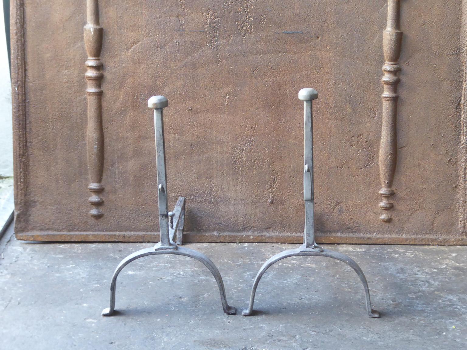 19th century French Napoleon III andirons. The andirons are made or wrought iron and have spit hooks to grill food.







