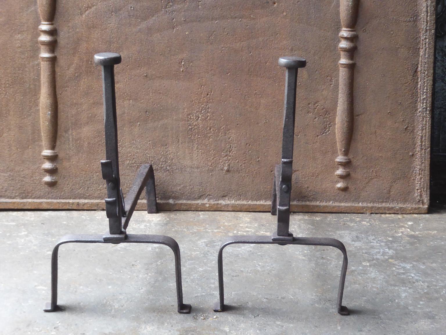 Large 19th century French Napoleon III andirons. The andirons are made or wrought iron and have spit hooks to grill food.







