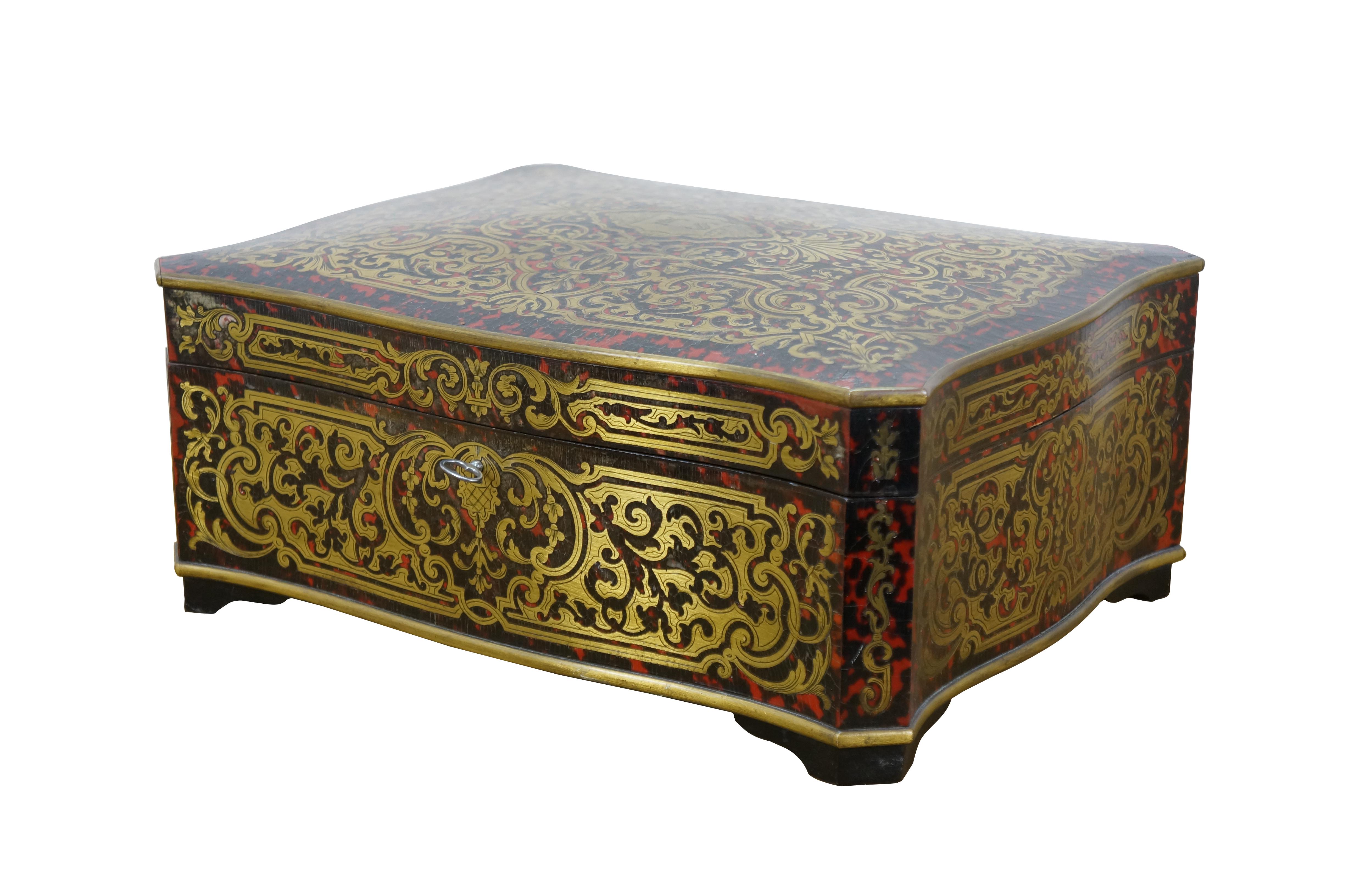 Antique 19th century Napoleon III era French Marquetry Boulle box. Red and black tortoiseshell with foliate brass inlay. Decoration on top includes the monogram LS. Rectangular form with scalloped edges and cut corners. Key included; lock is