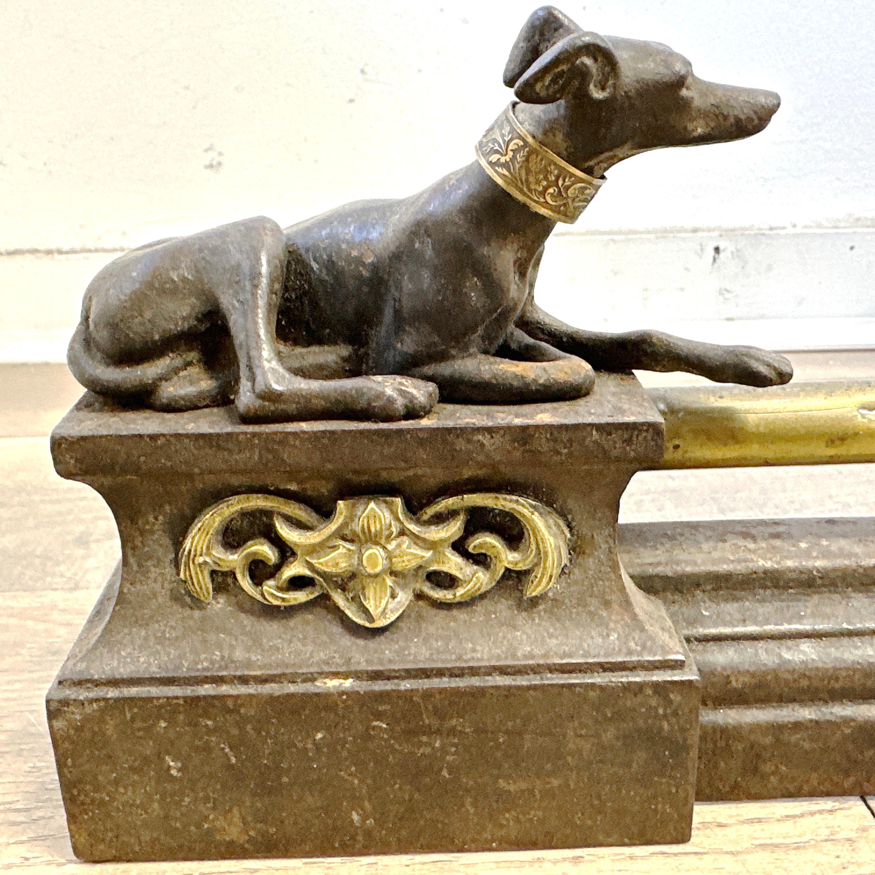 Here is an Antique French Napoleon III Greyhound Fireplace Chenet set. 

This very beautiful and old extendable fireplace bar with its 19th century cast iron log holder features two greyhounds. Each dog is lying on a base decorated with a rockery.