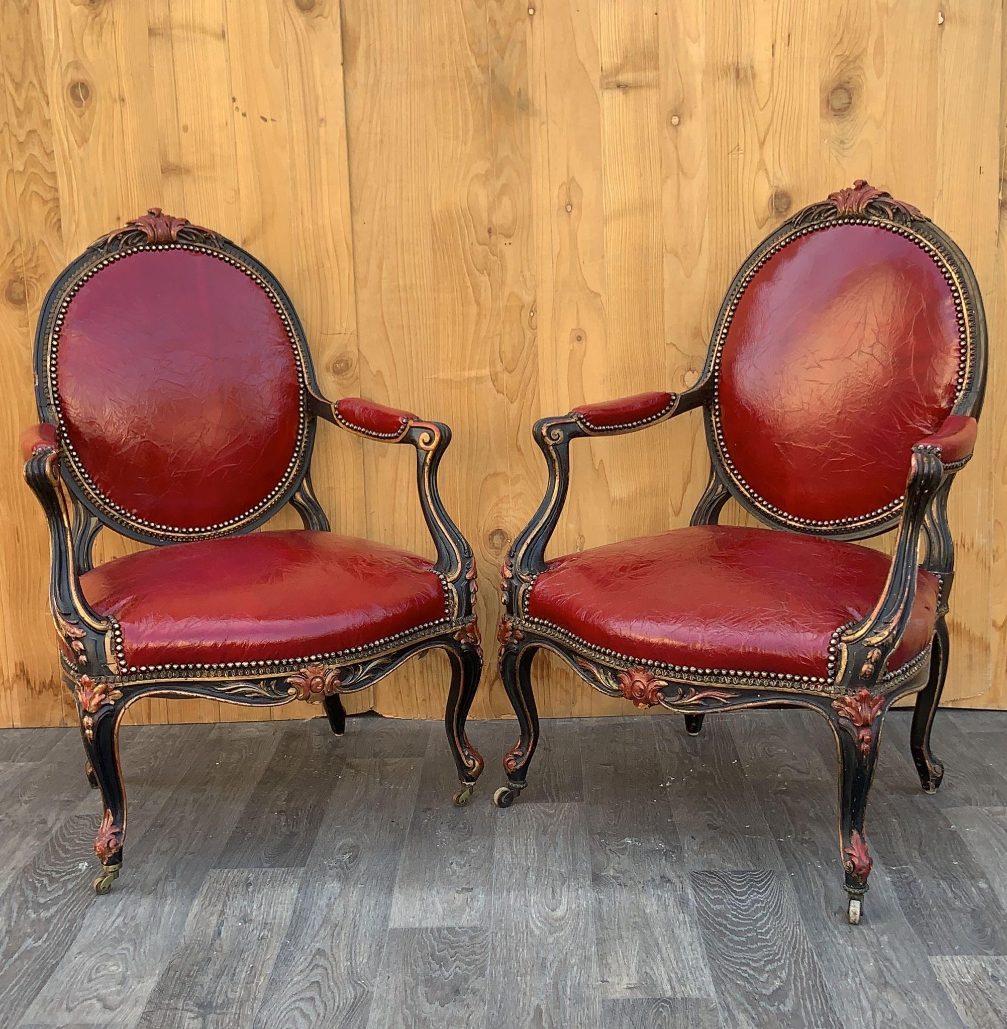 Antique French Napoleon III Carved Armchairs Newly Upholstered in Deep-Red Distressed Italian Leather - Pair 

Unique antique pair of Napoleon III period armchairs with curly frame and armrests on s-legs. The high, rounded backrest, seat and