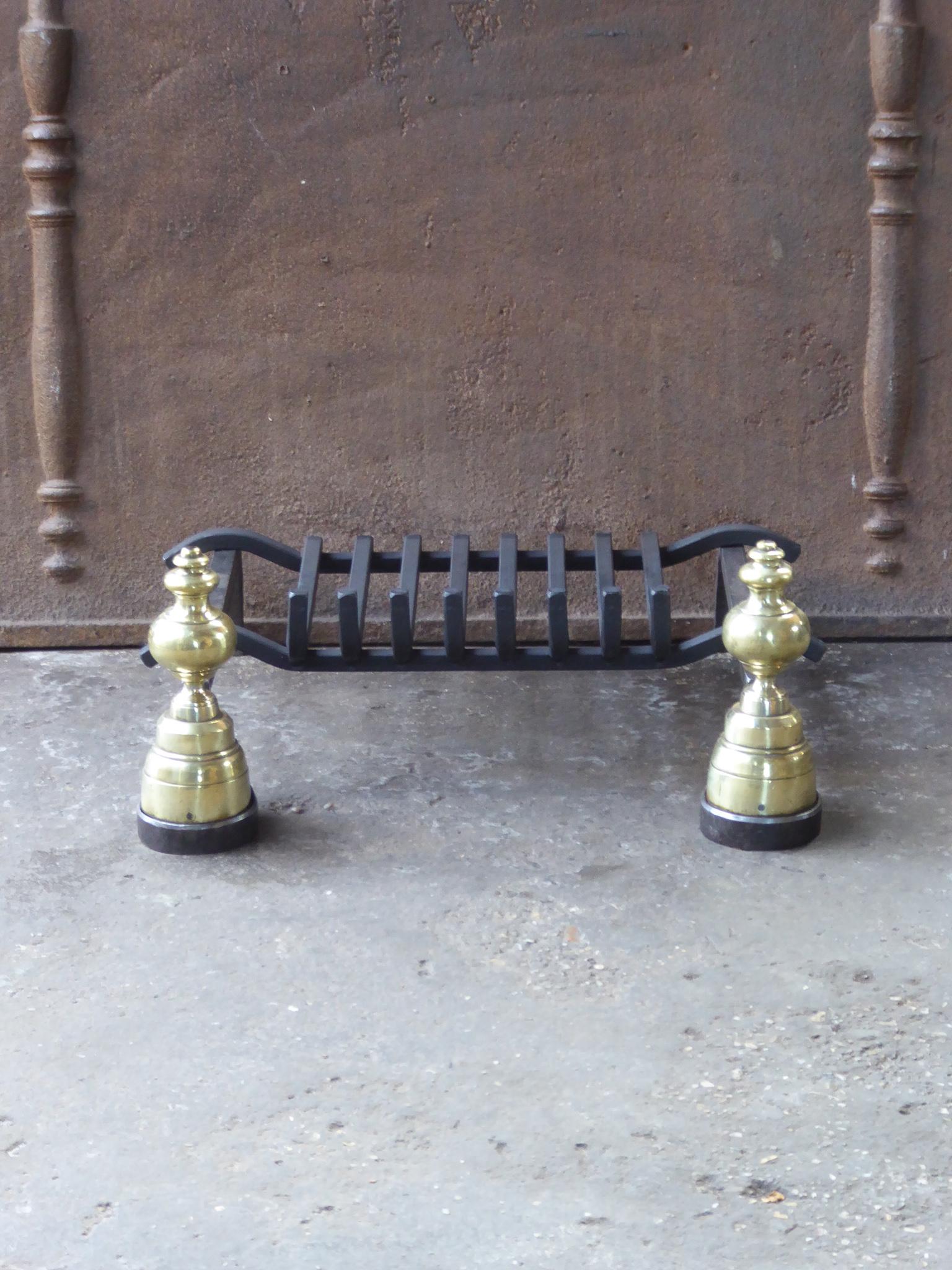 Late 19th or early 20th century French Napoleon III fireplace basket, fire basket made of wrought iron and brass. The basket is in a good condition and is fully functional.