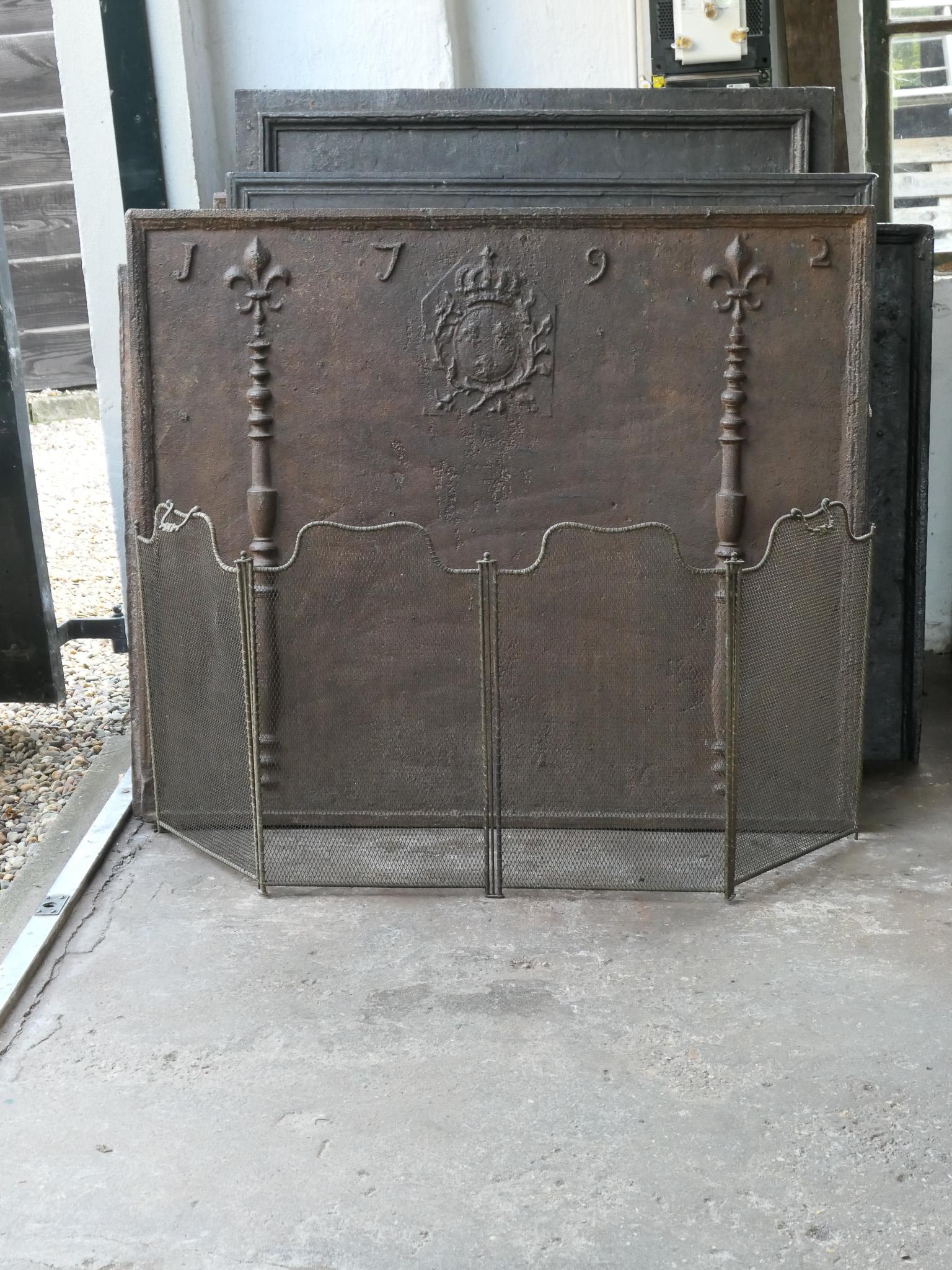 19th century French Napoleon III 4-panel fireplace screen. The screen is made of iron and iron mesh and has a brown color. It is in a good condition and is fit for use in front of the fireplace.
