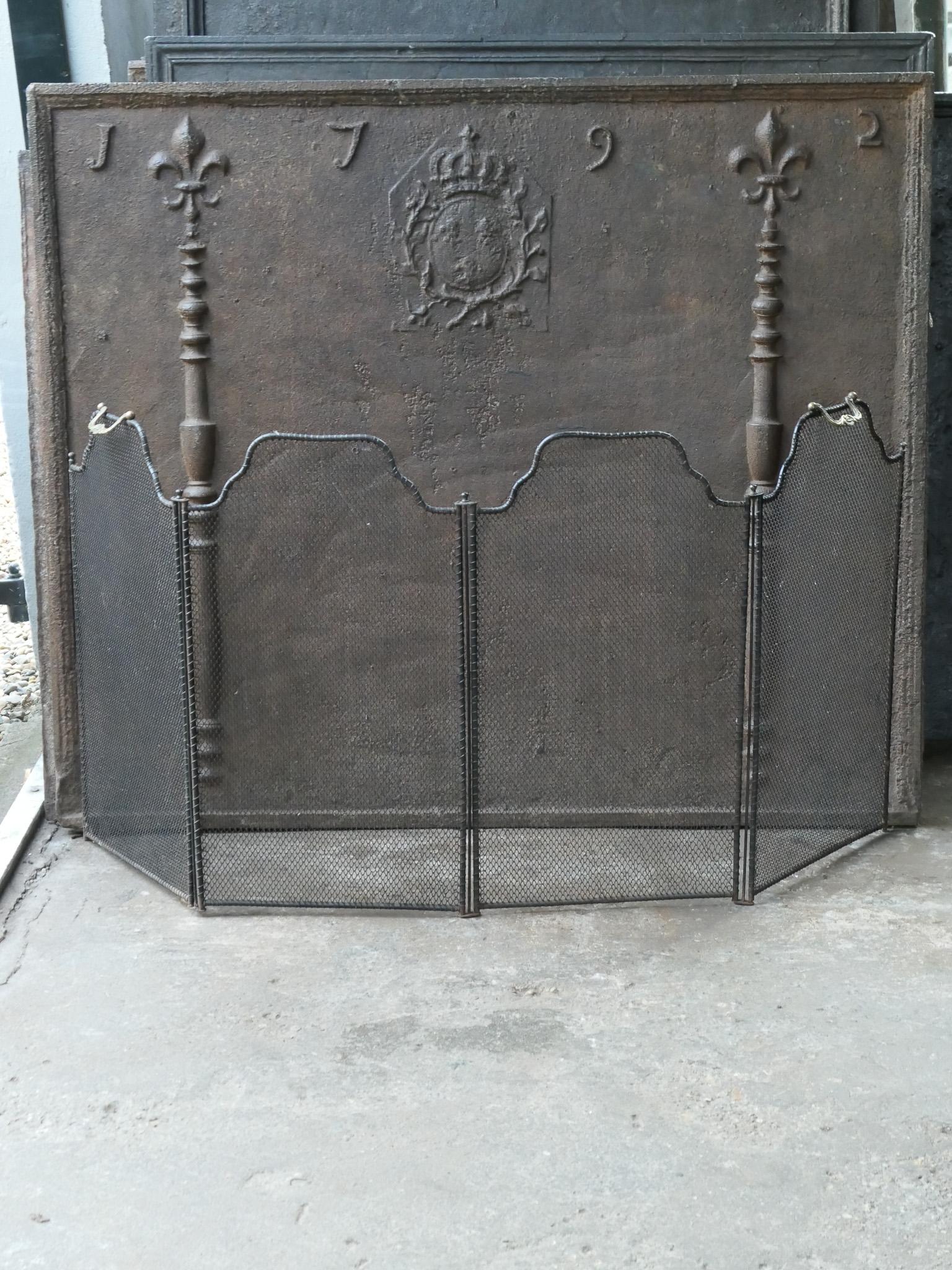 19th century French Napoleon III 4-panel fireplace screen. The screen is made of iron and iron mesh and has black color. It is in a good condition and is fit for use in front of the fireplace.