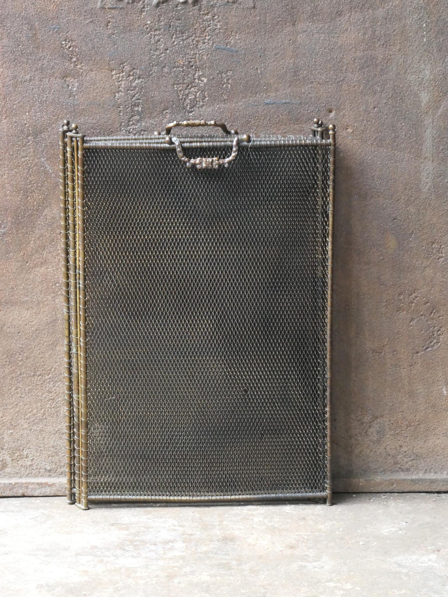 19th century French Napoleon III 4-panel fireplace screen. The screen is made of iron and iron mesh and has brownish color. It is in a good condition and is fit for use in front of the fireplace.