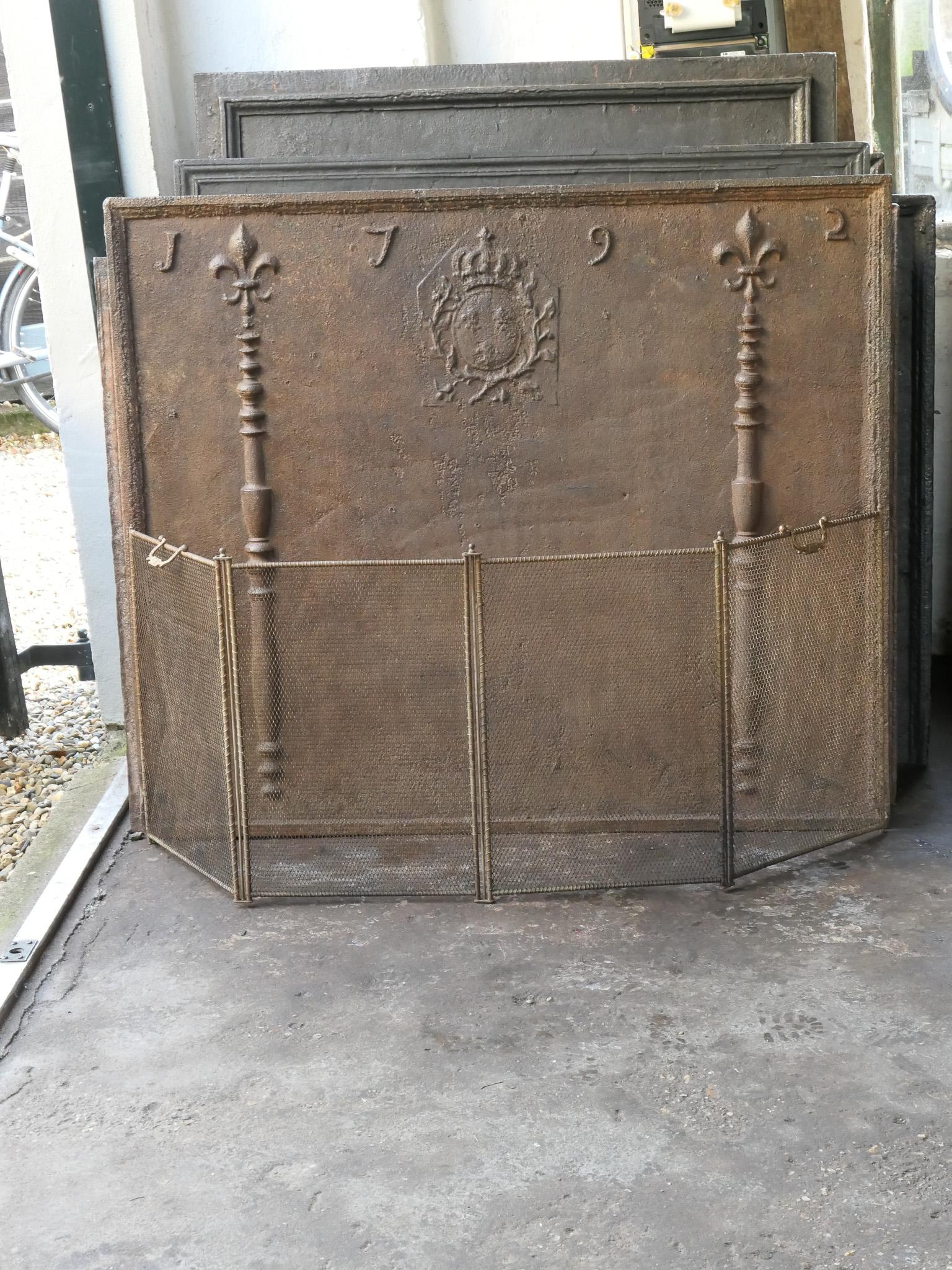 19th century French Napoleon III 4-panel fireplace screen. The screen is made of brass, iron and iron mesh. It is in a good condition and is fit for use in front of the fireplace.