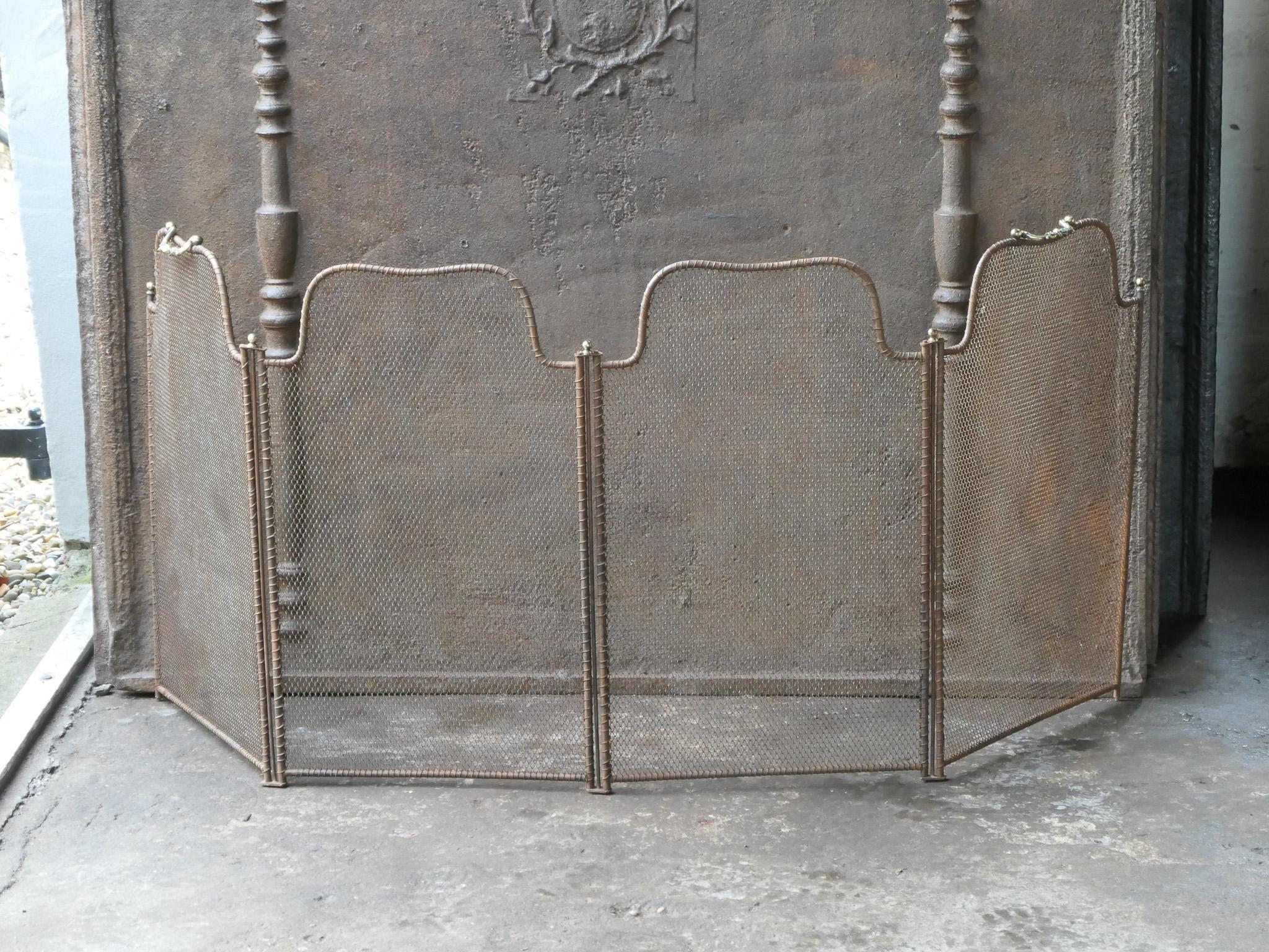 19th century French Napoleon III 4-panel fireplace screen. The screen is made of brass, iron and iron mesh. 

It is in a good condition and is fit for use in front of the fireplace.