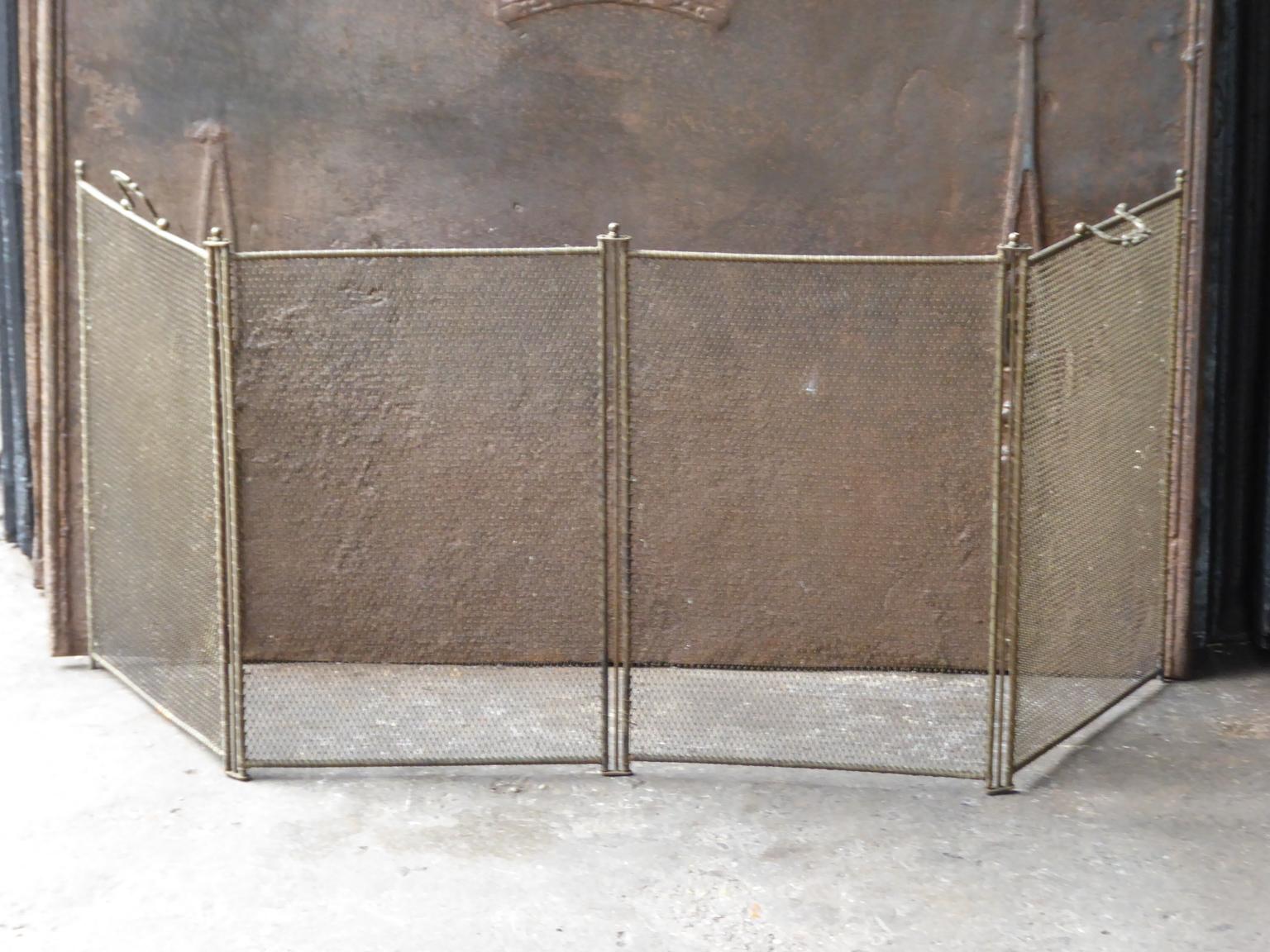 19th century French Napoleon III four-panel fireplace screen. The screen is made of brass and iron mesh. It is in a good condition and is fit for use in front of the fireplace.