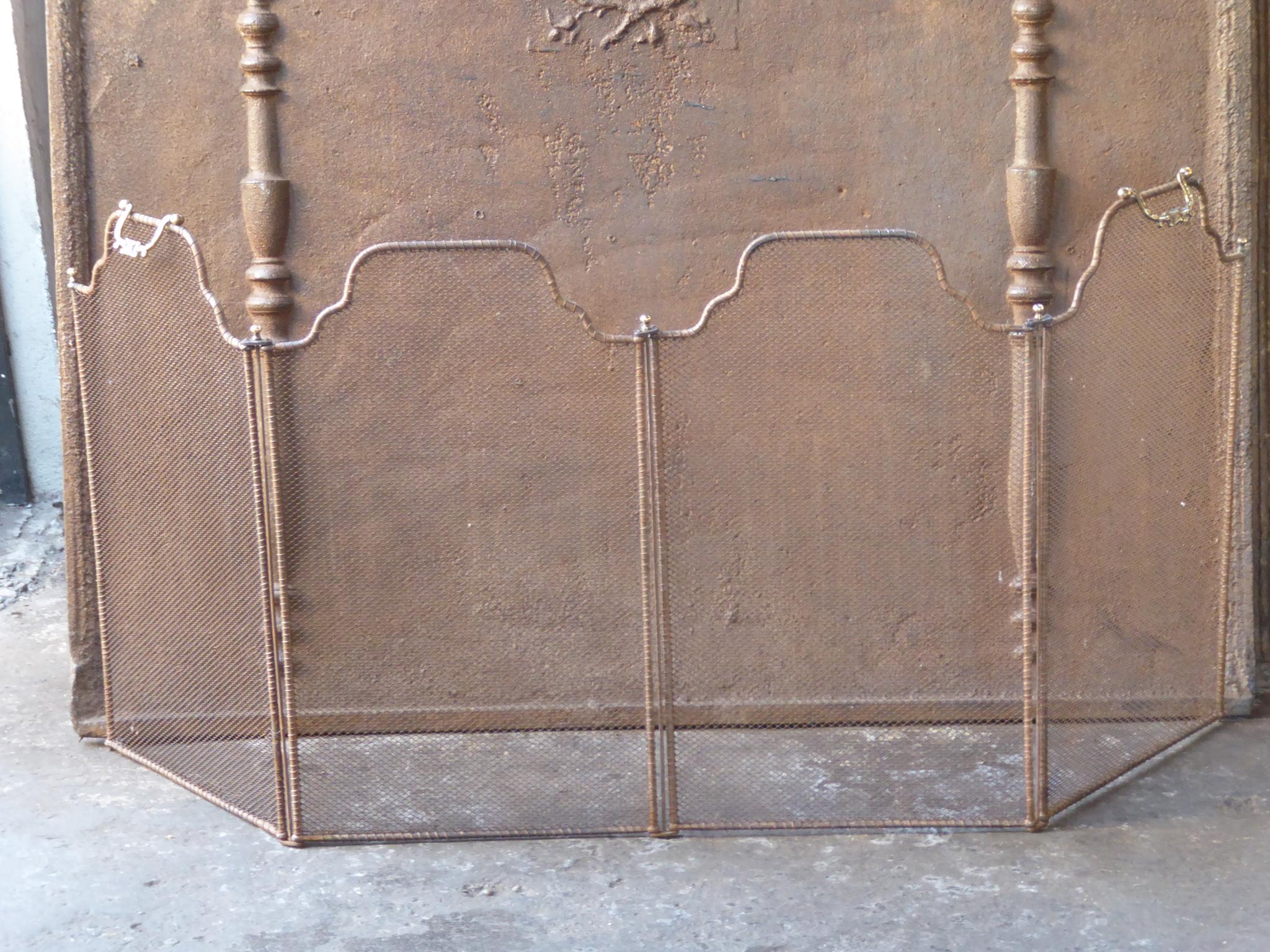 19th Century French Napoleon III four-panel fireplace screen. The screen is made of brass, iron and iron mesh. It is in a good condition and is fit for use in front of the fireplace.