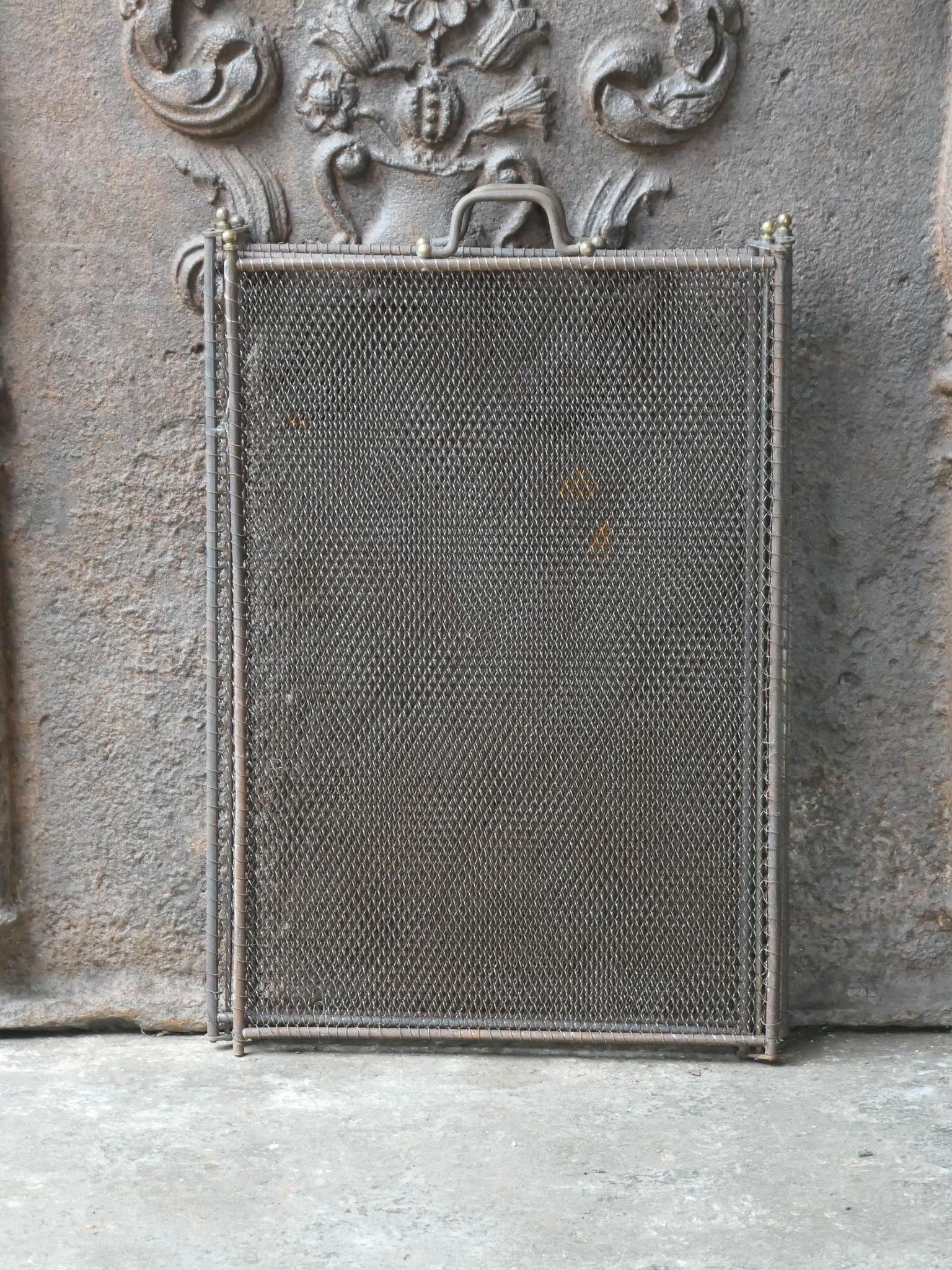 19th century French Napoleon III four-panel fireplace screen. The screen is made of brass, iron and iron mesh. It is in a good condition and is fit for use in front of the fireplace.