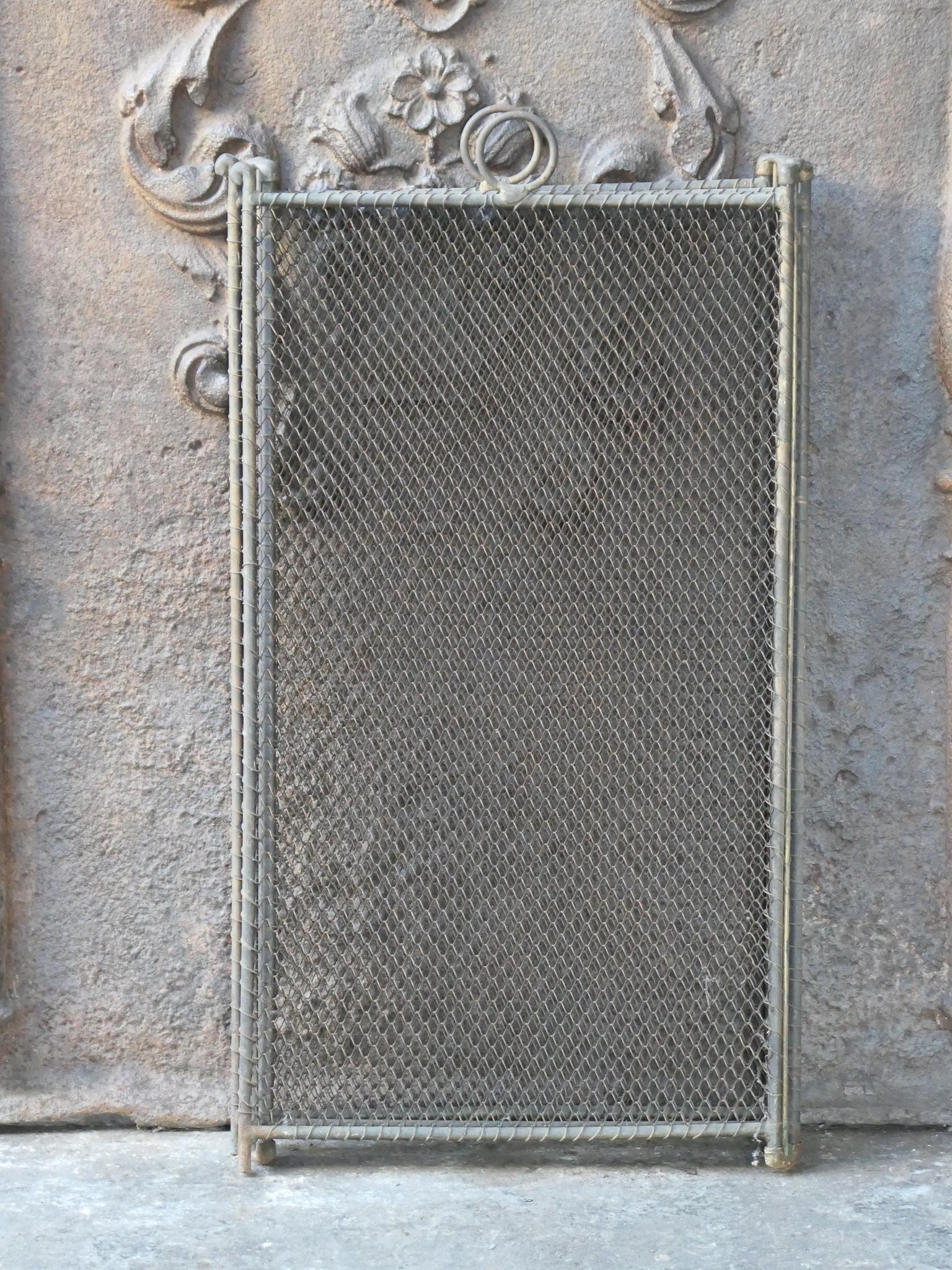 19th Century French Napoleon III four-panel fireplace screen. The screen has several elegant details and is made of brass, iron and iron mesh. It is in a good condition and is fit for use in front of the fireplace.