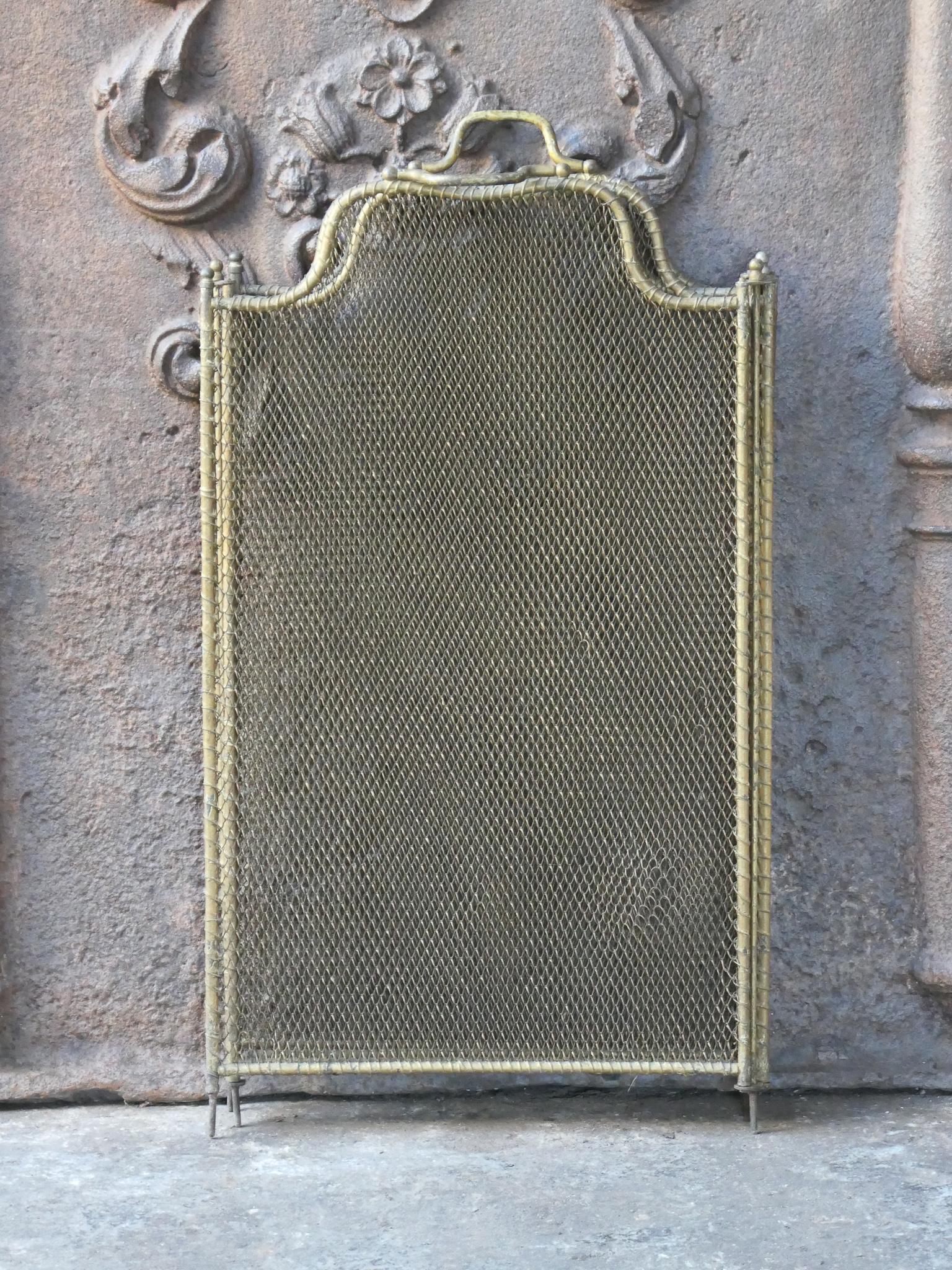 19th Century French Napoleon III 4-panel fireplace screen. The screen is made of brass, iron and iron mesh. It is in a good condition and is fit for use in front of the fireplace.