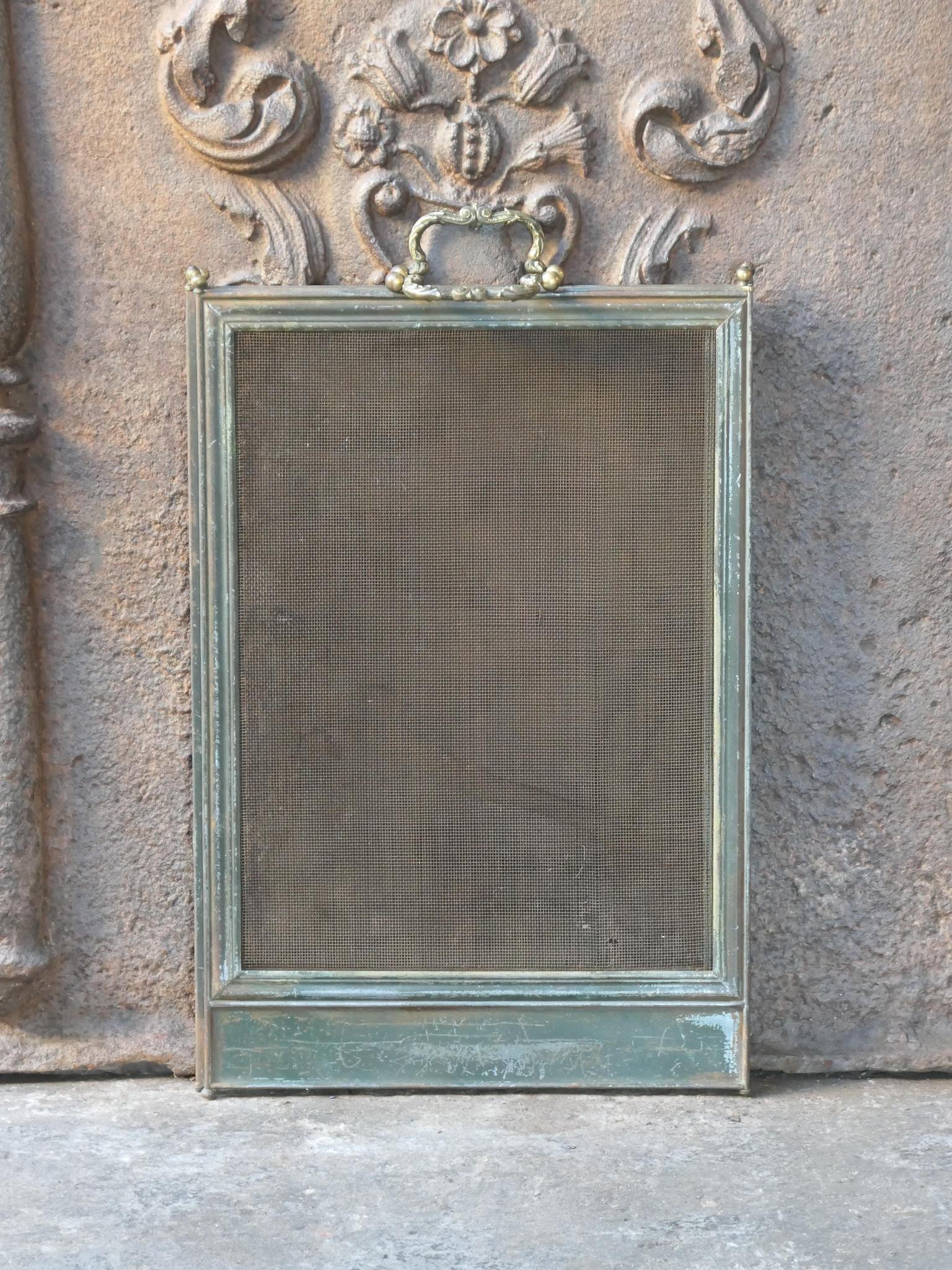 19th - 20th century French Napoleon III four-panel fireplace screen. The screen is made of brass, iron and iron mesh. It is in a good condition and is fit for use in front of the fireplace.